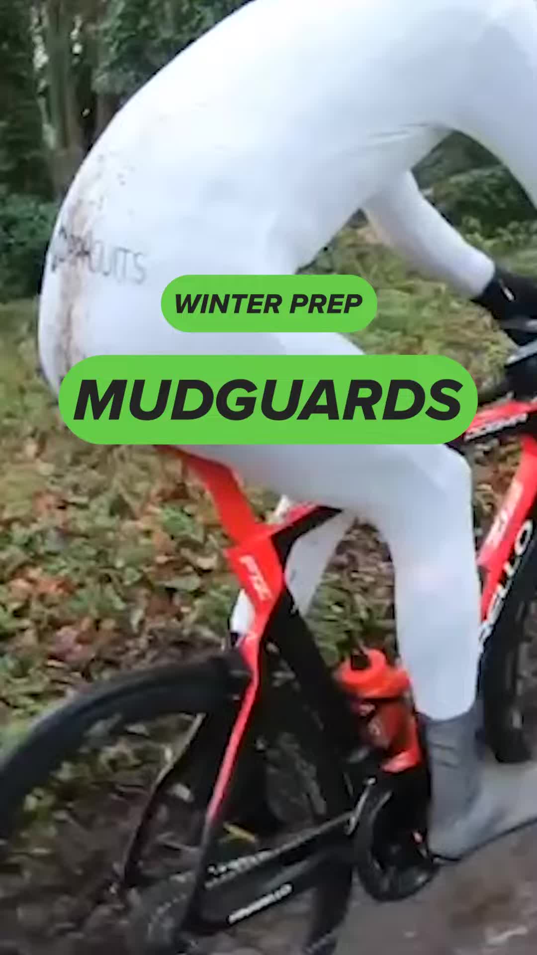 Image of a cyclist riding in the rain, emphasizing the need for mudguards.