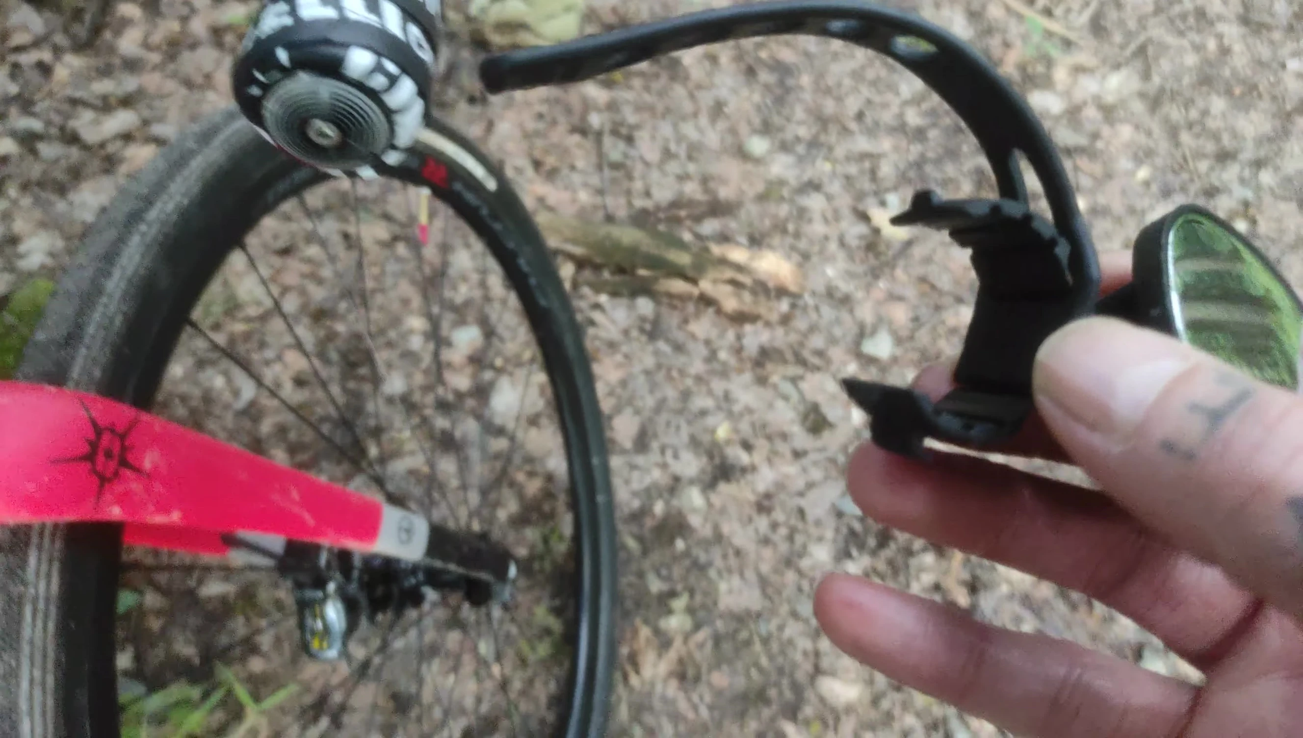 Demonstrating the Zefal mirror's adjustability.