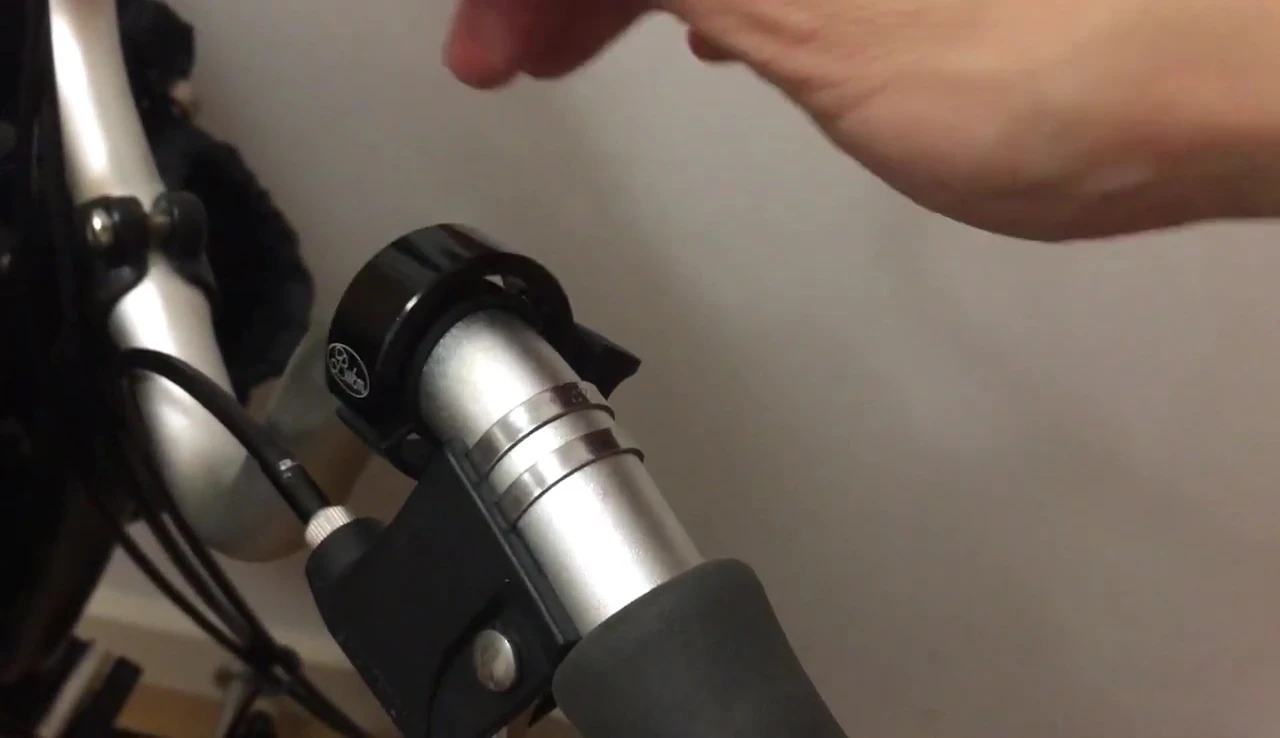 Demonstrating the ease of removing the compact bell.