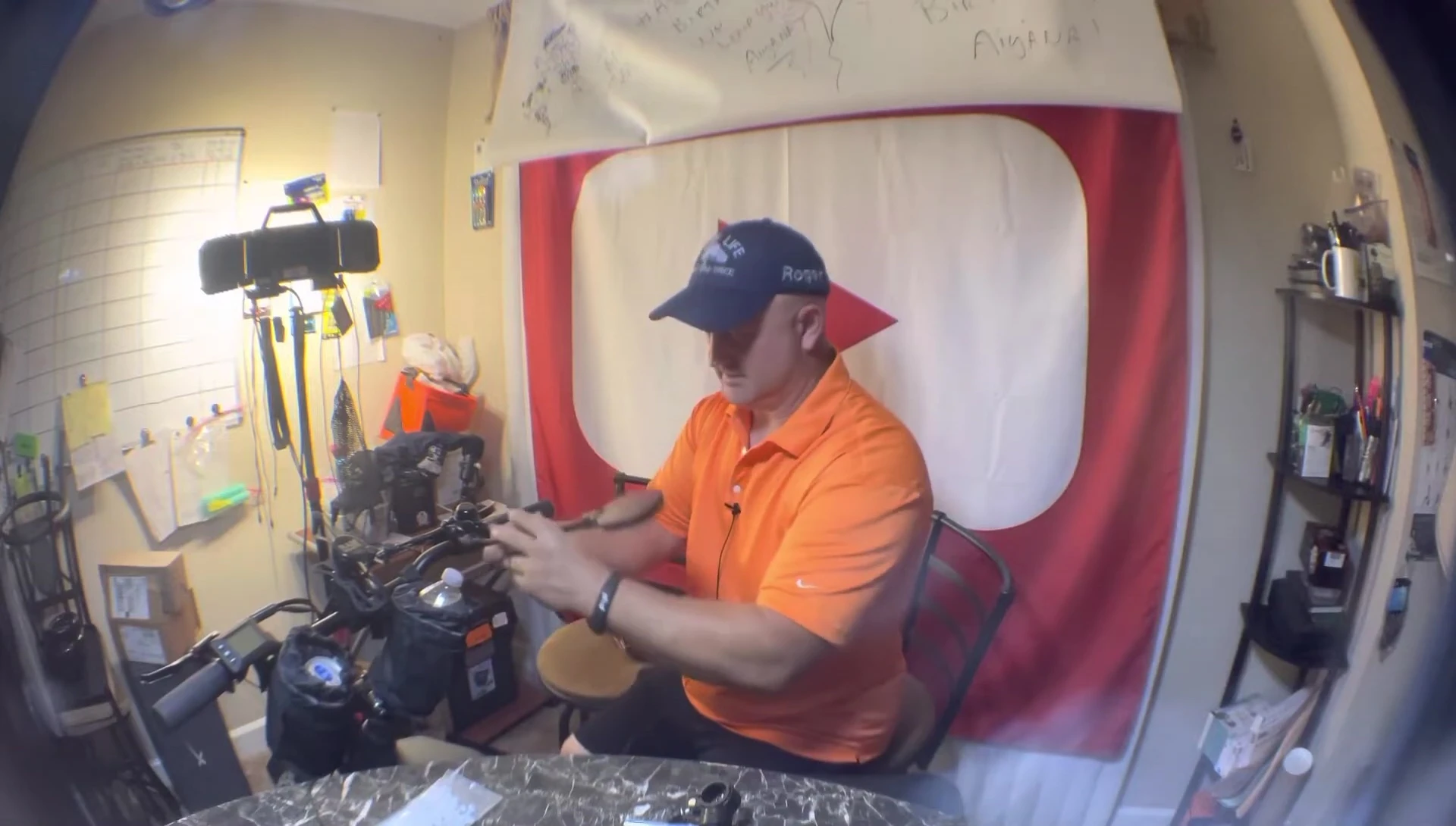 Attempting to tighten the mirror with the spacers.