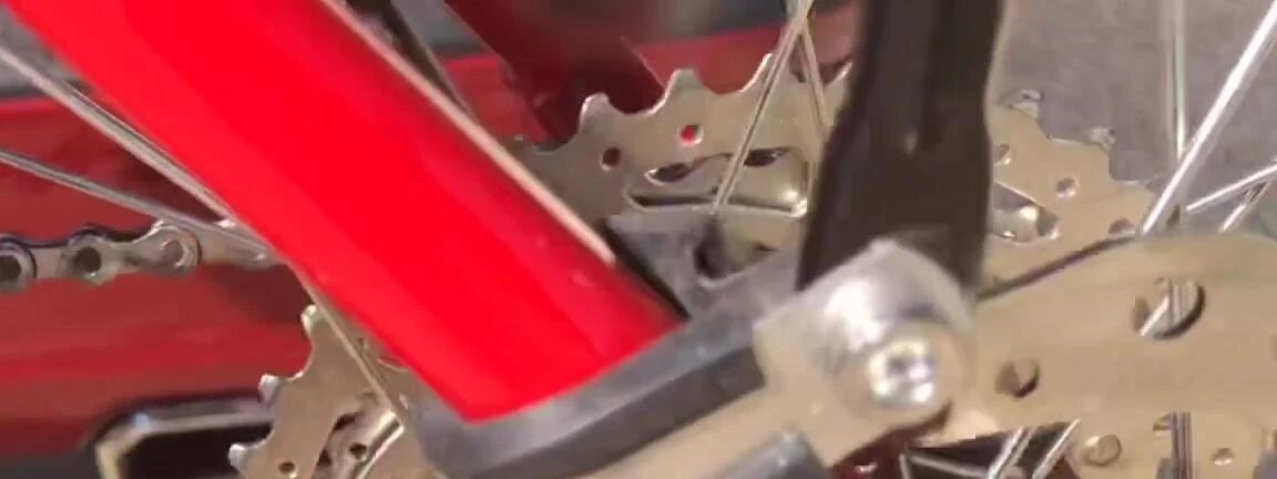 Close-up of the Peak clamps securing the rear rack to the seat post.