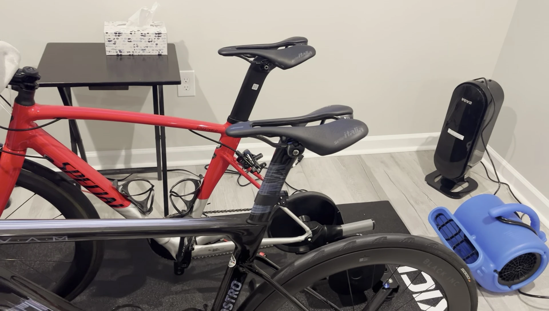 The cyclist adjusting the saddle tilt.