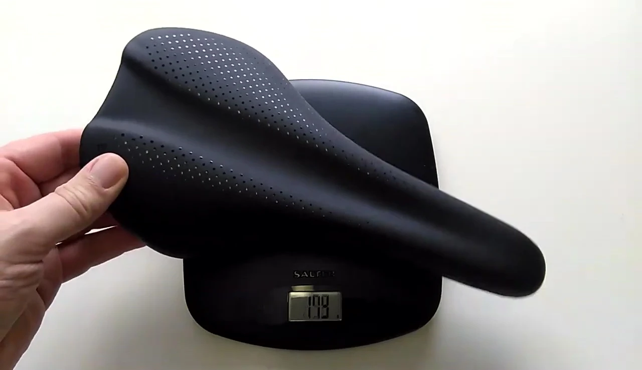 Close-up shot of the saddle's material and reflective dots.