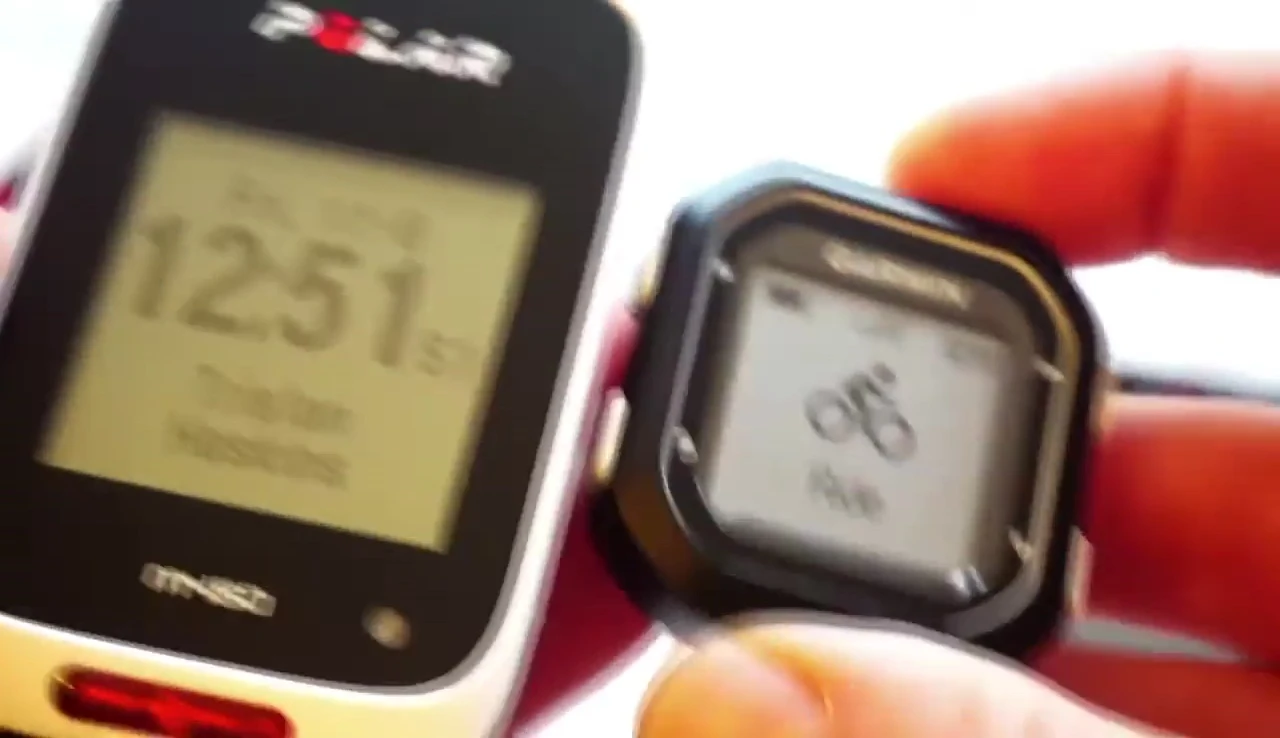 Close-up comparison shot of the Polar M450 and Garmin Edge 25, highlighting their compact sizes.