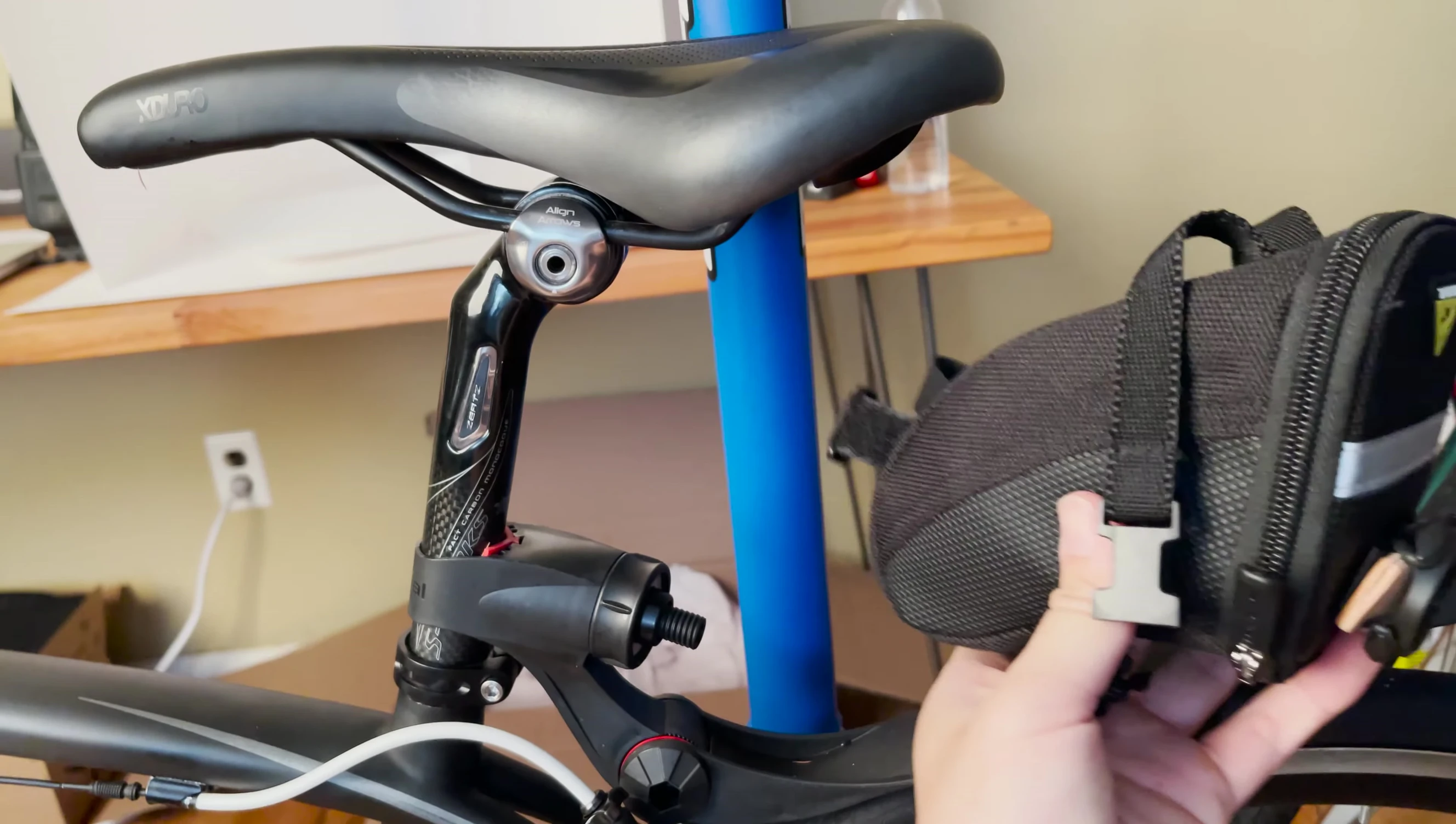The speaker points out the issues of mounting the radar with a saddle bag.