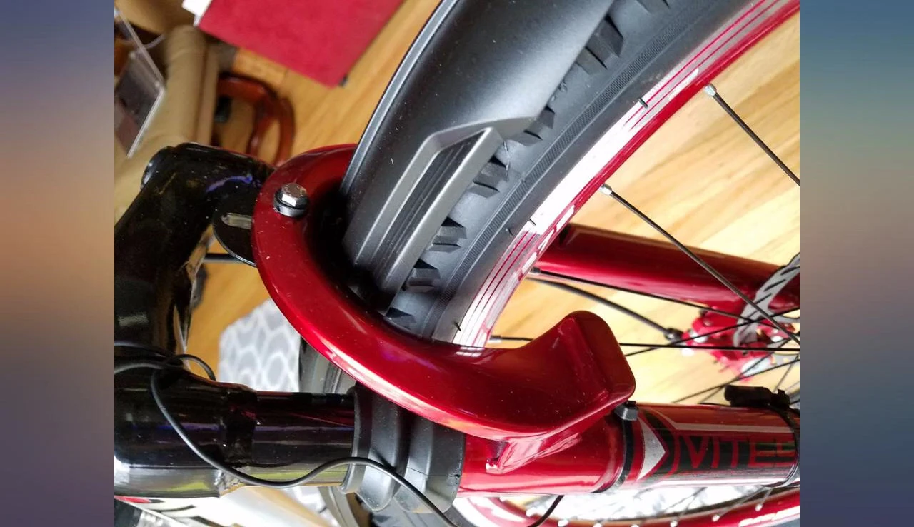 A close-up shot showing the fenders slightly offset from the tire.