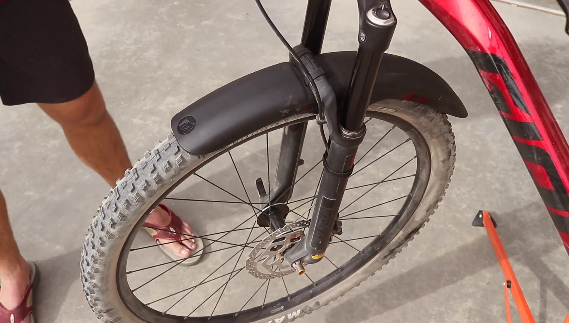 Mudguard protecting the fork stanchions.
