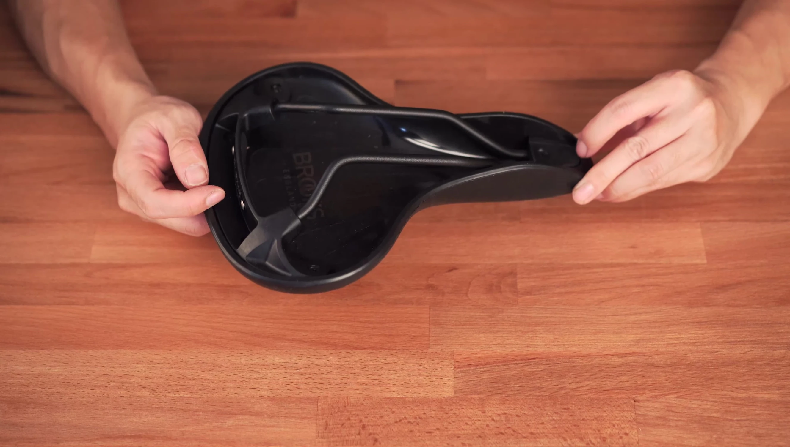 Detail shot showcasing the replaceable top section of the saddle.