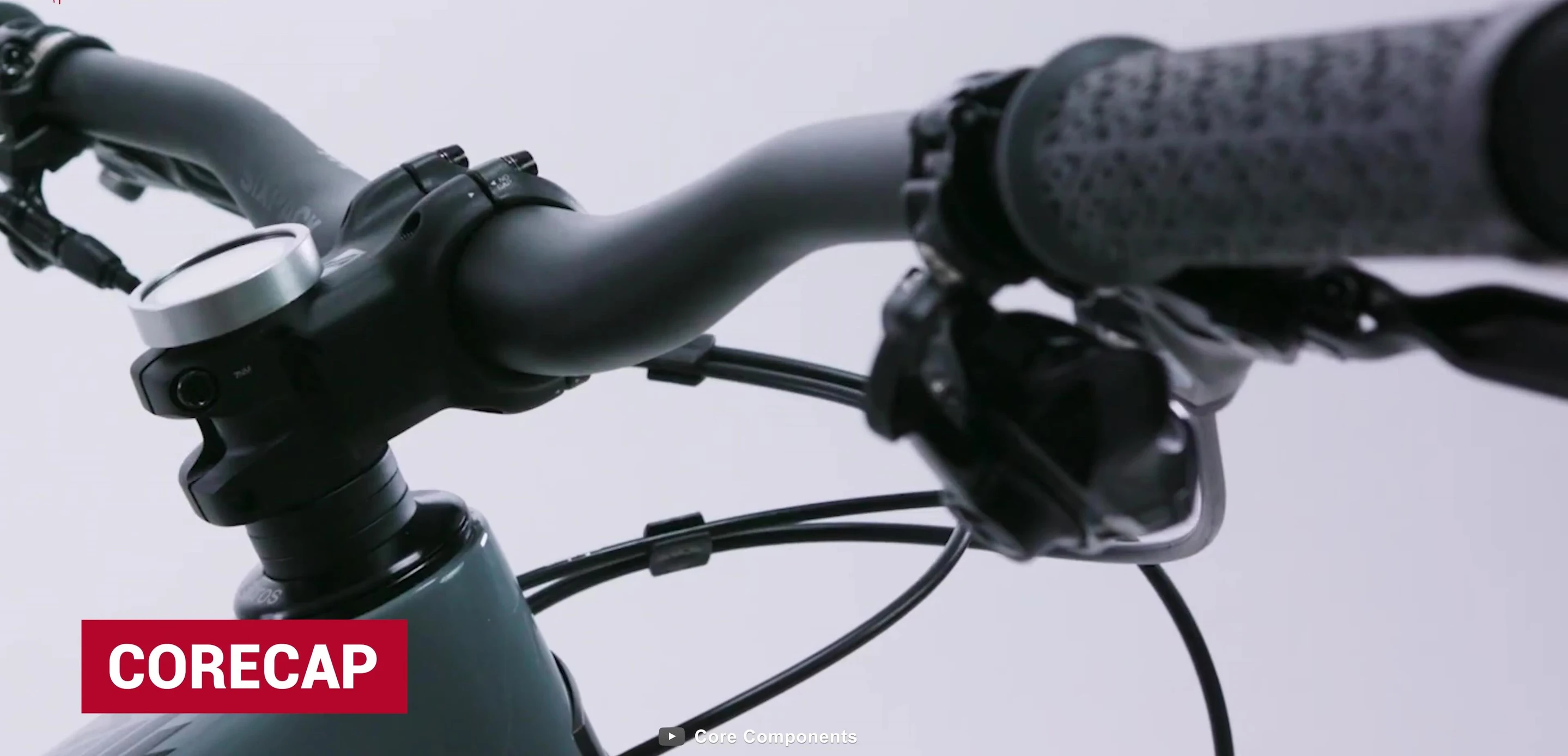 Core Cap displayed prominently on a bicycle's handlebar