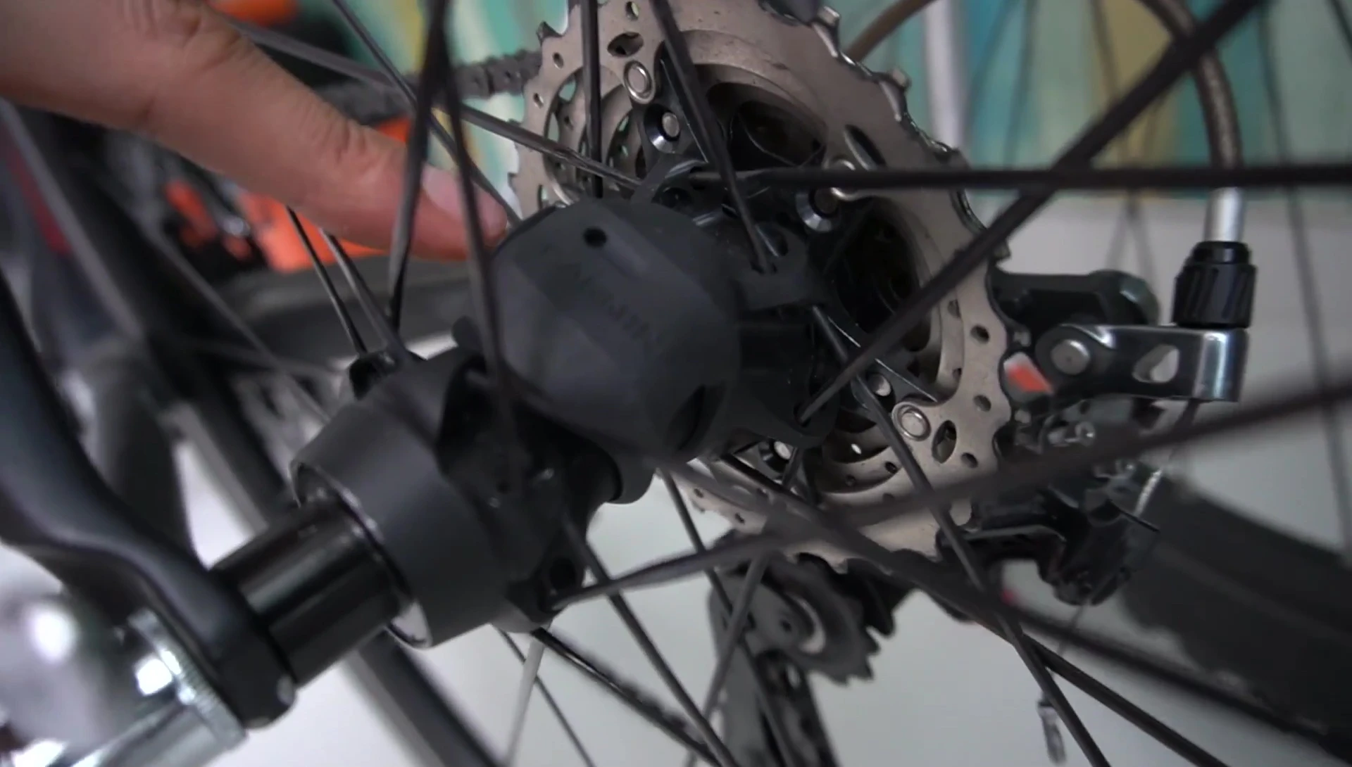The Garmin speed and cadence sensor attached to the bike.
