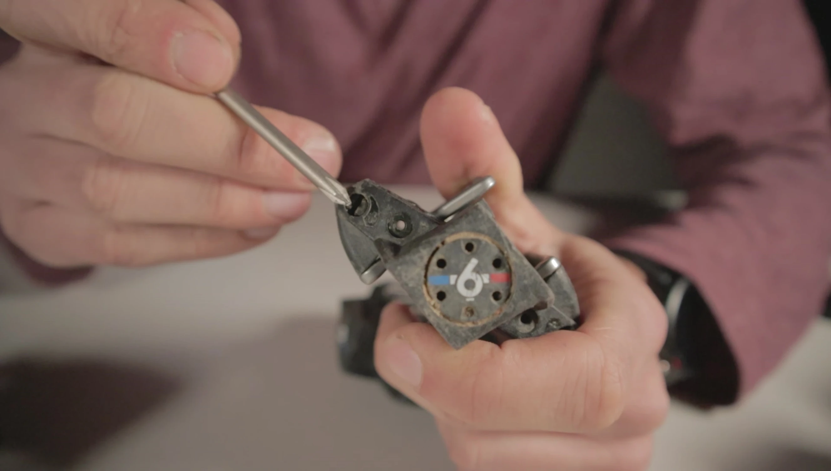 Close-up of the adjustable tension screw on the pedal