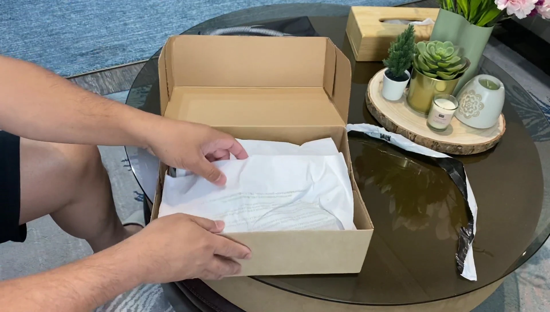 A shot of the shoes being taken out of the box.