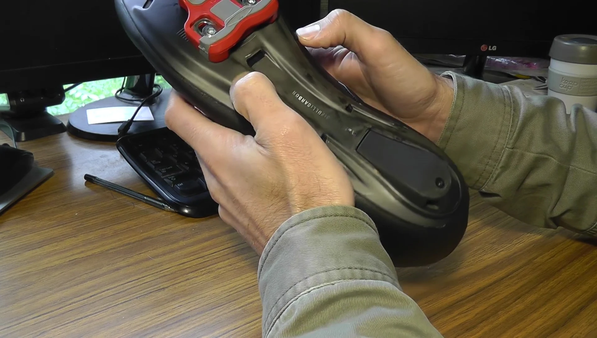 The area of the shoe where the cleats are rubbing.