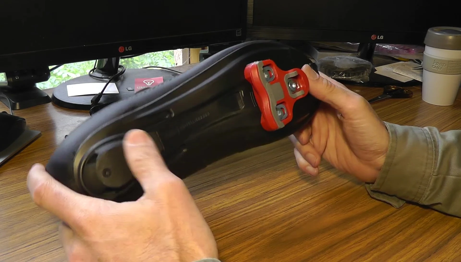 The reviewer's feet on the pedals, highlighting the power transfer.