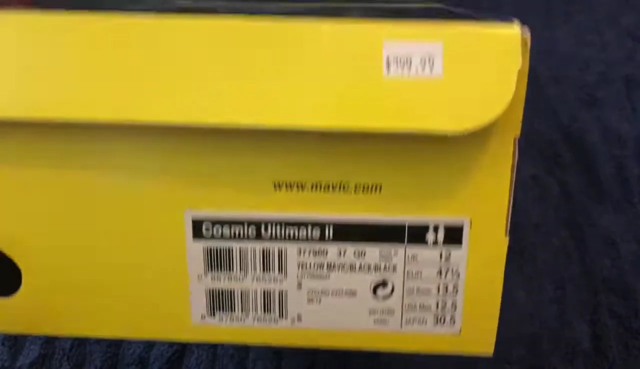 The reviewer trying on the shoes