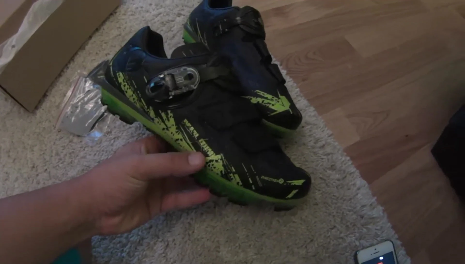 The shoes being shown, indicating the size.