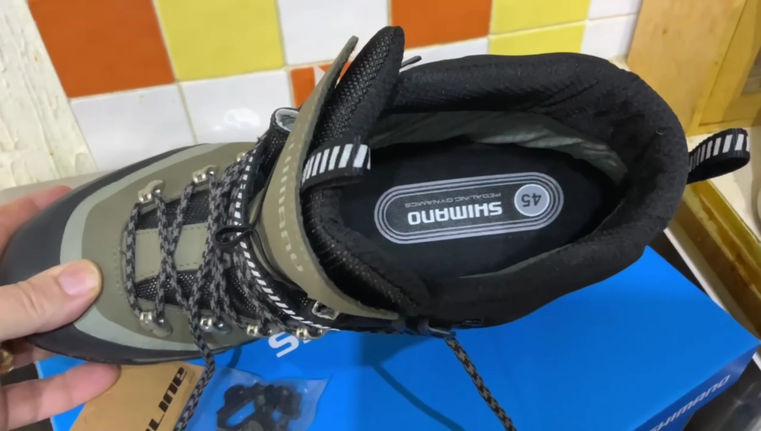 Reviewer showing the shoes on his feet