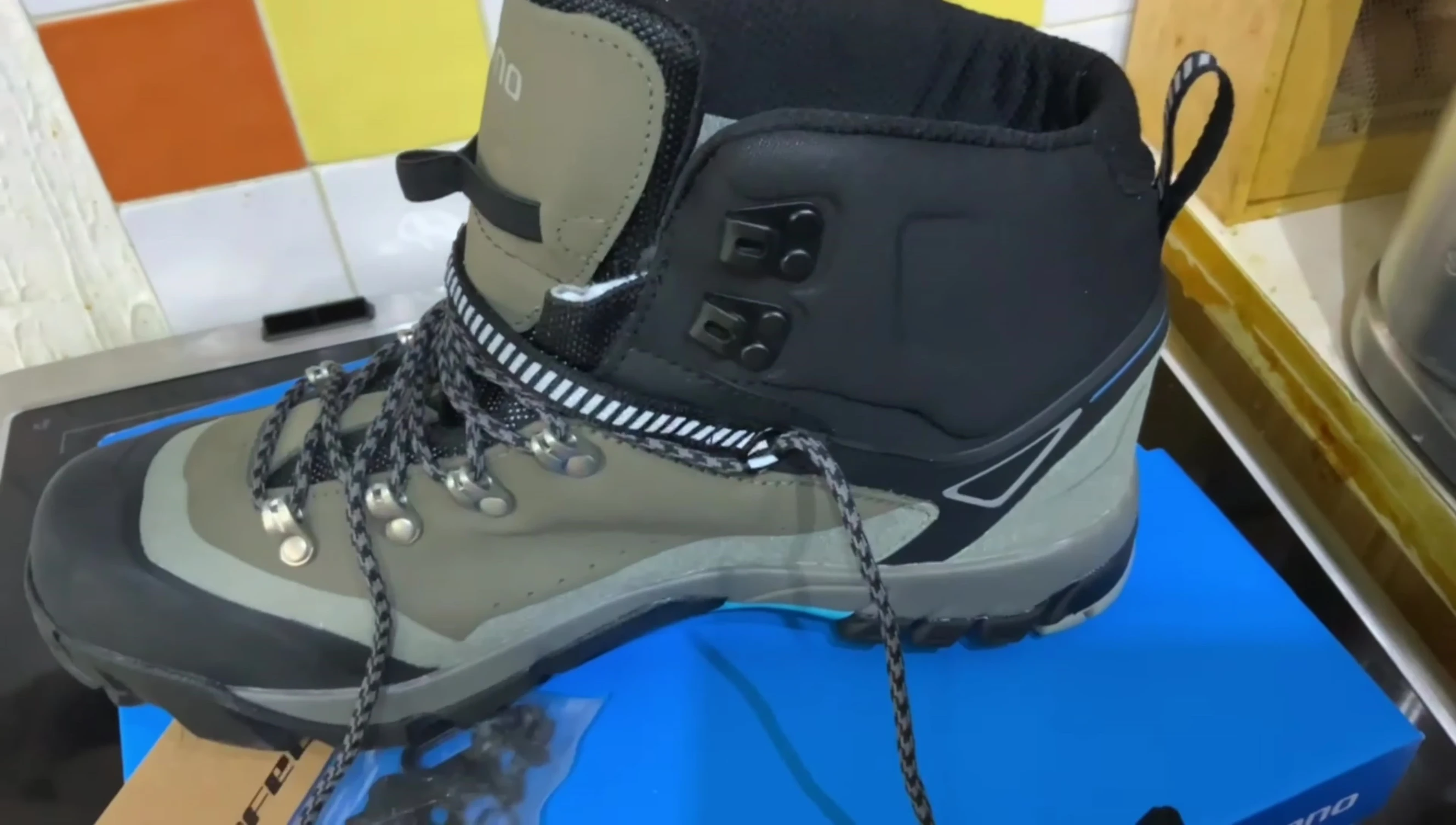View highlighting the higher ankle cut of the shoe