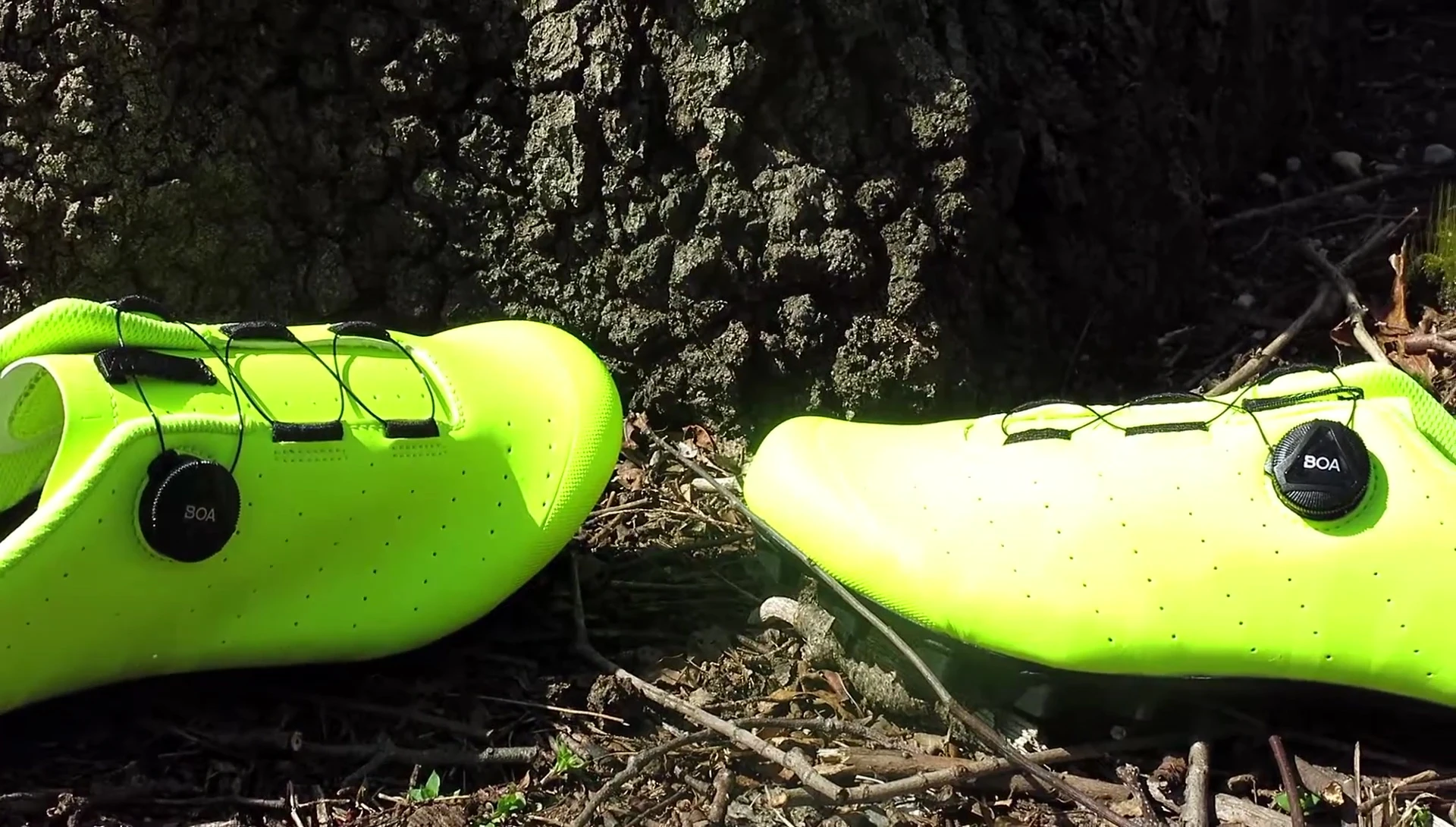 Close-up of the shoe's synthetic leather upper showing the laser-cut ventilation holes.