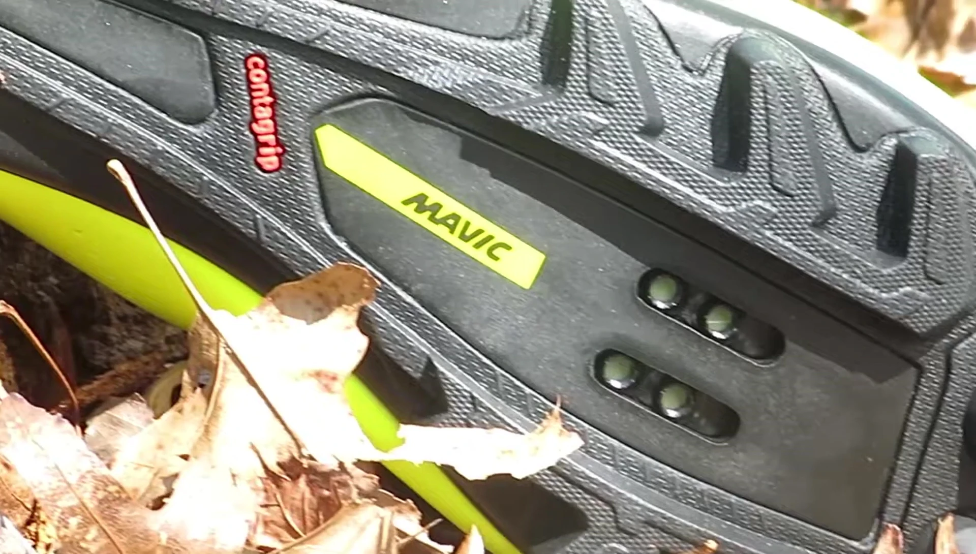 A shot that shows the bottom of the shoe emphasizing the cleat compatibility.