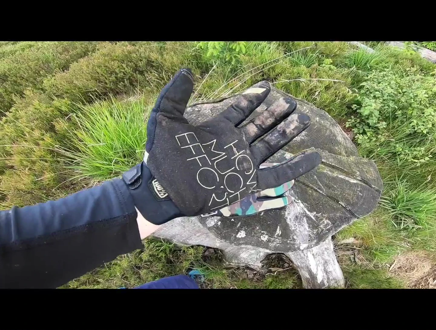 The speaker highlighting the grip and feel of the gloves while riding.