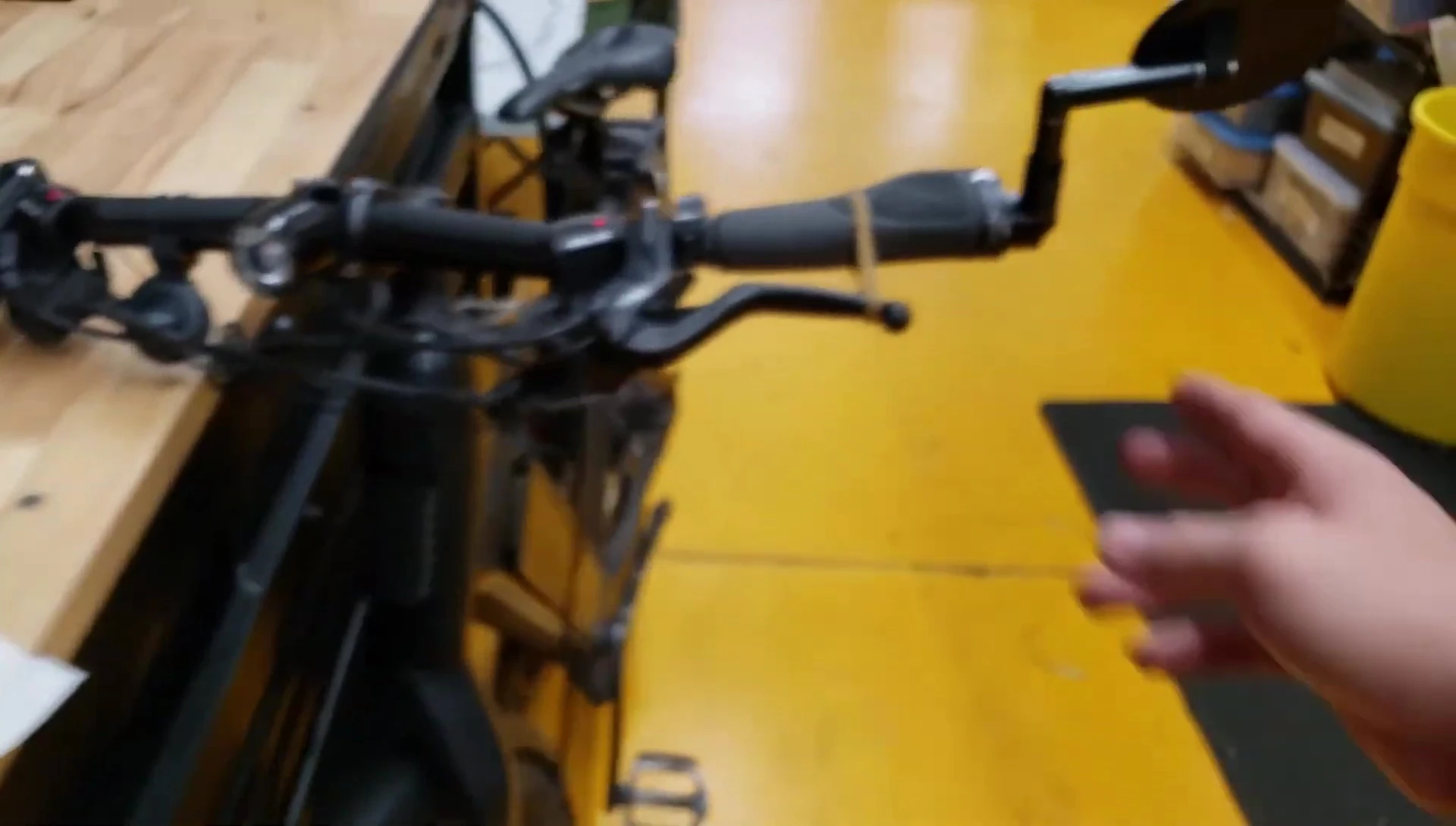 The rider showing off the repaired mirror on their bicycle