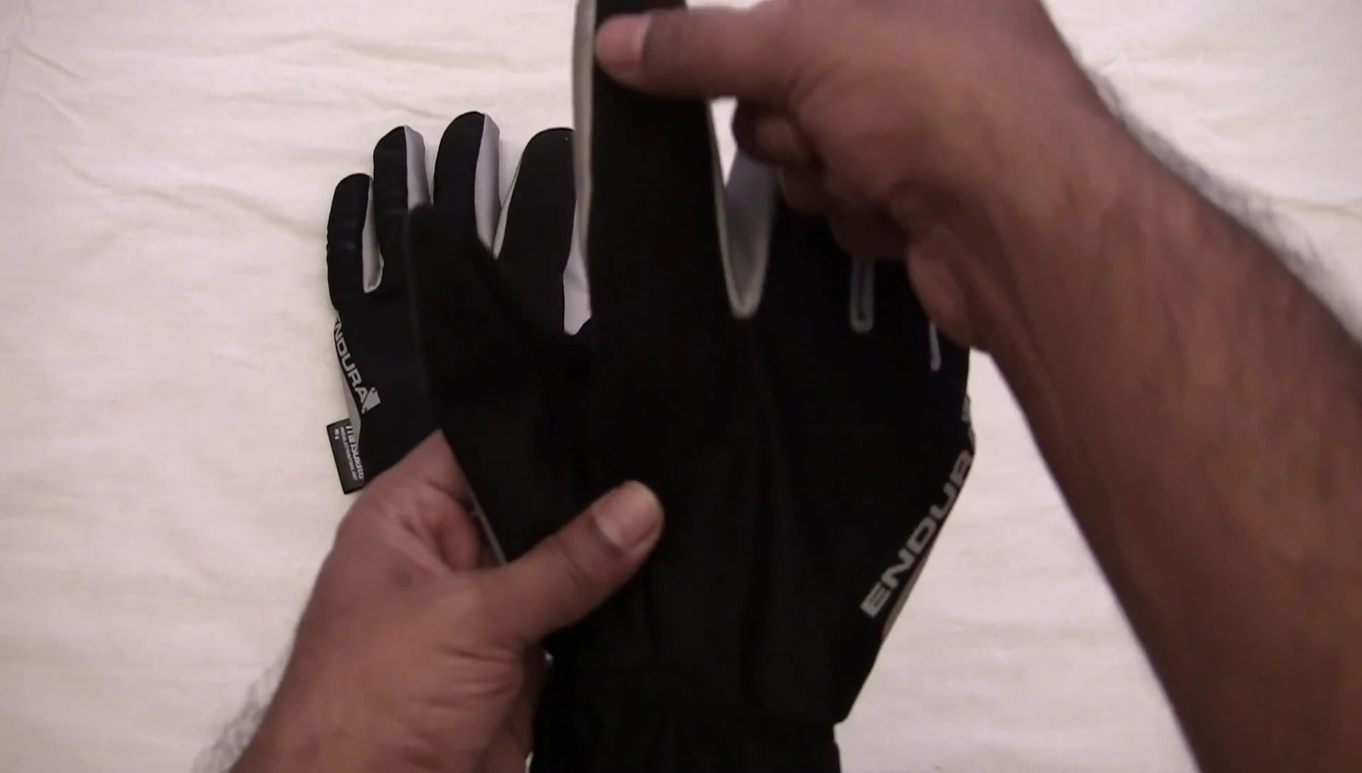 Detailed view of the terry towelling thumb panel and elastic cuff.