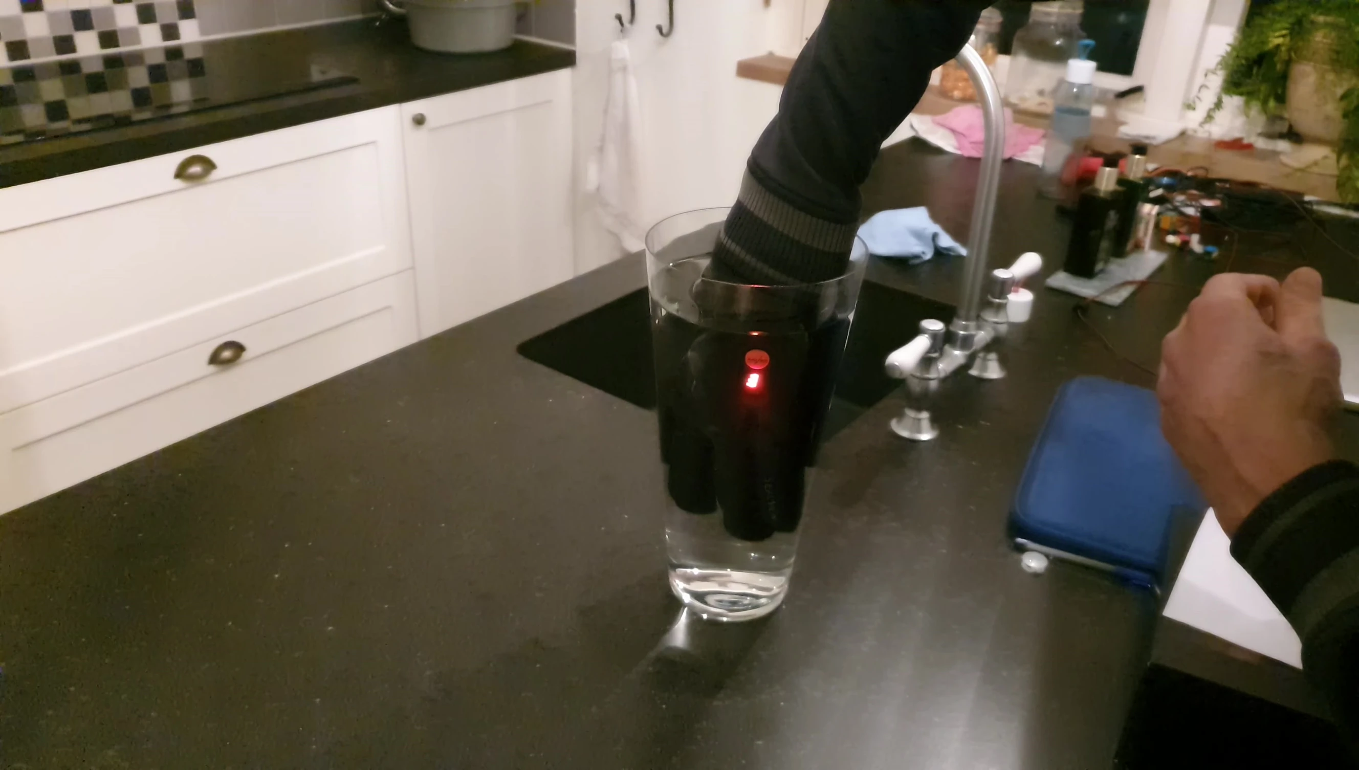 The reviewer's hand after submerging the glove in water, showing that it is still dry.