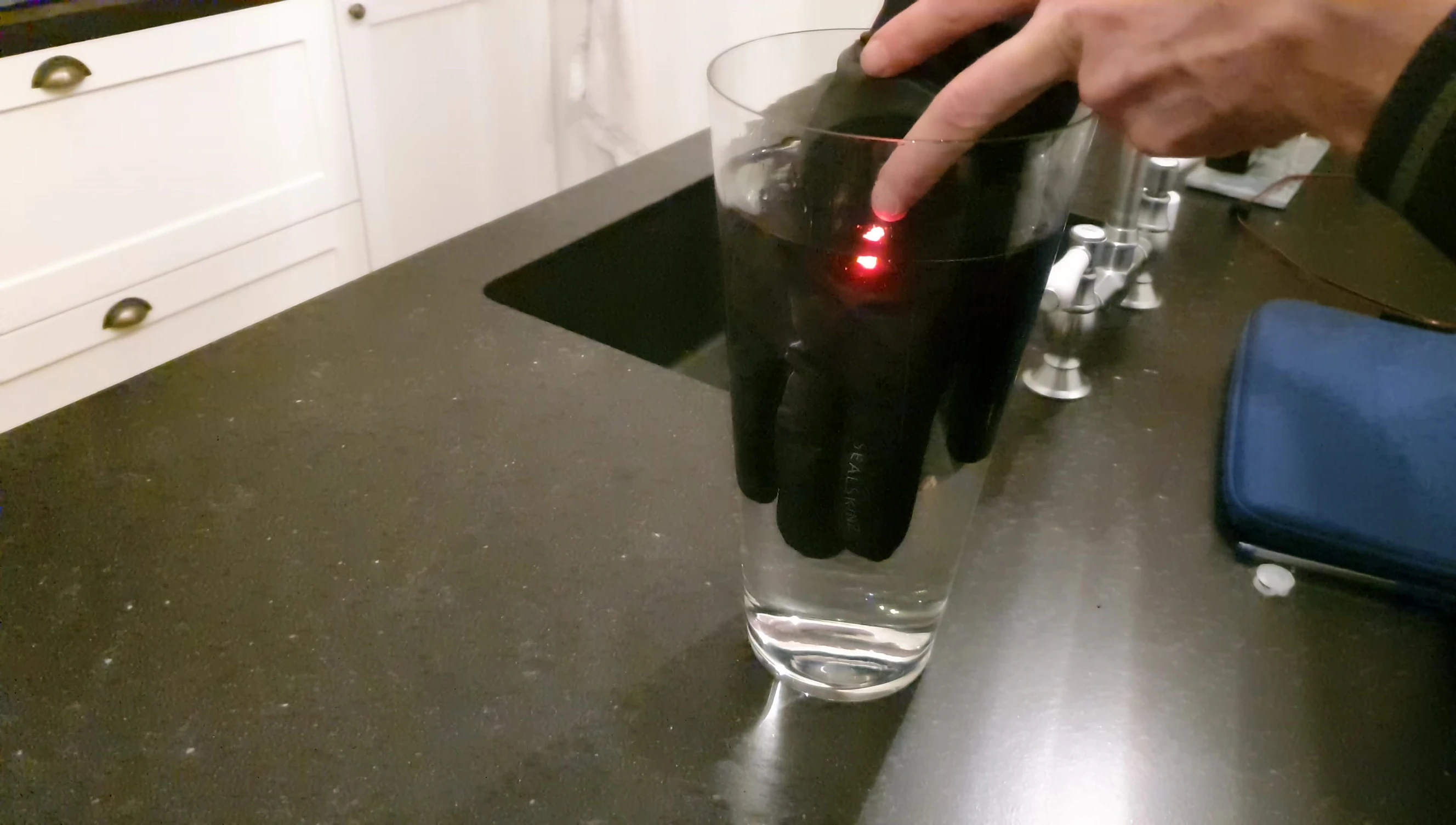 The reviewer showing their dry hands after the water test.