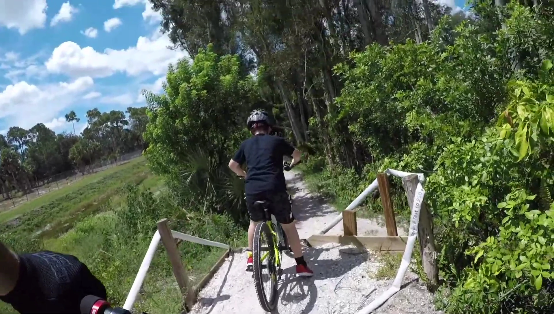 Action shot of the rider navigating a trail section