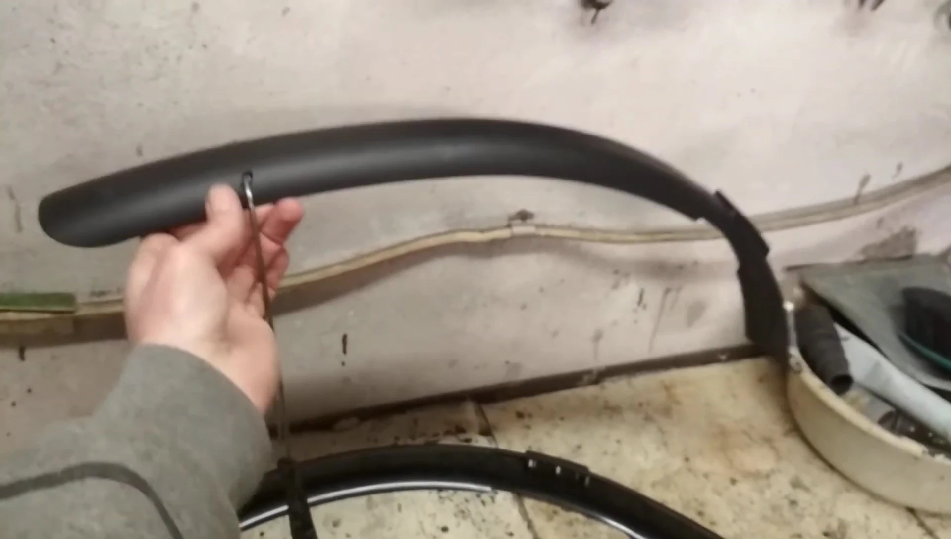 Close-up of the mudguard construction, showing its minimalistic design.