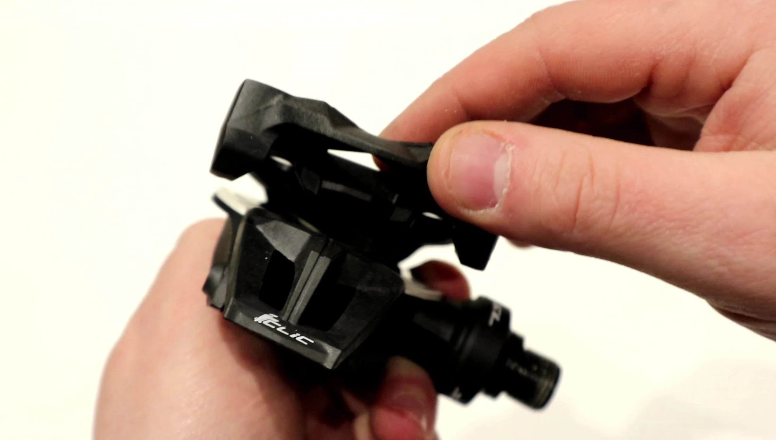 Cleat attached to the pedal, showing the engagement mechanism