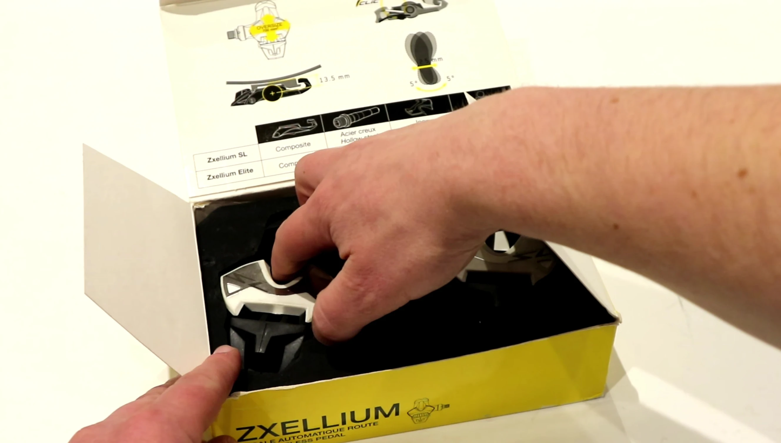 Close-up of the pedals being removed from the packaging