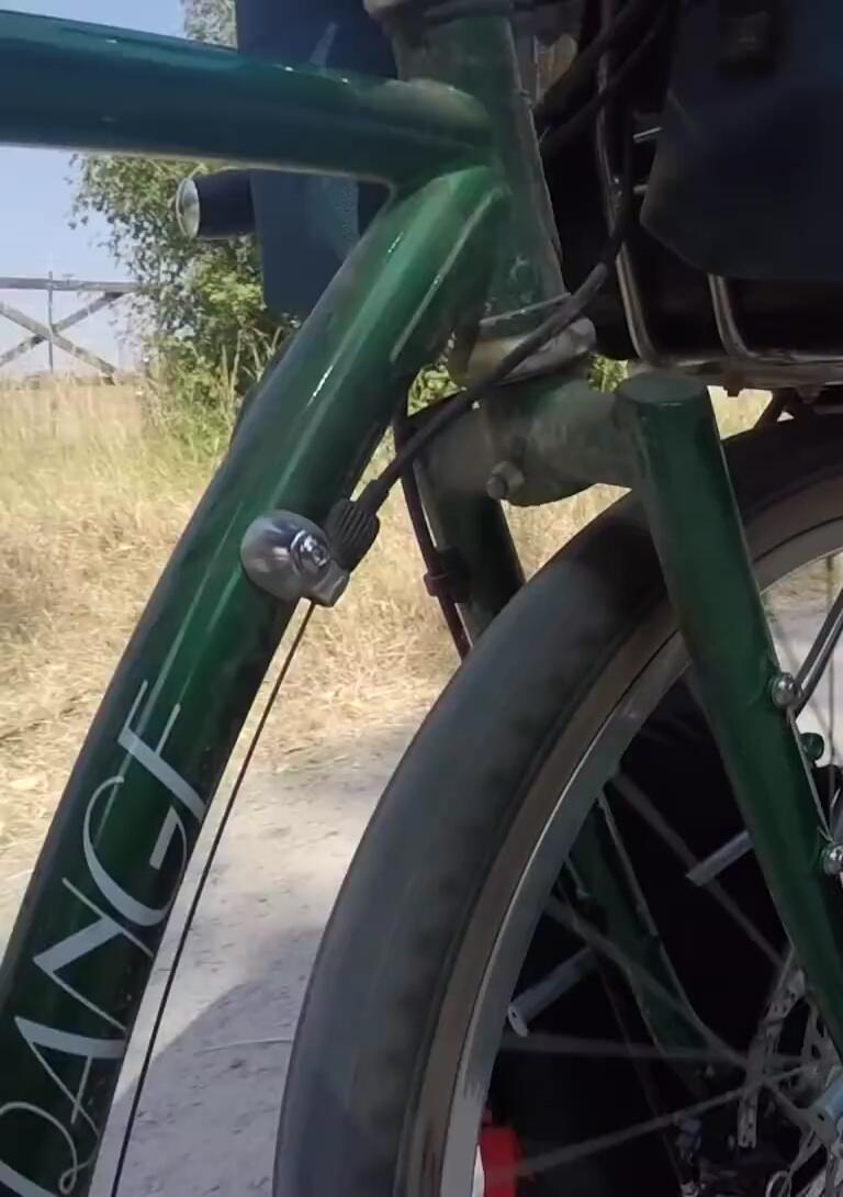 The panniers securely mounted on the bike rack.
