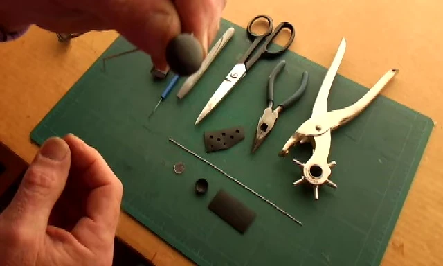 Close-up of the materials laid out for the DIY cycling mirror project.