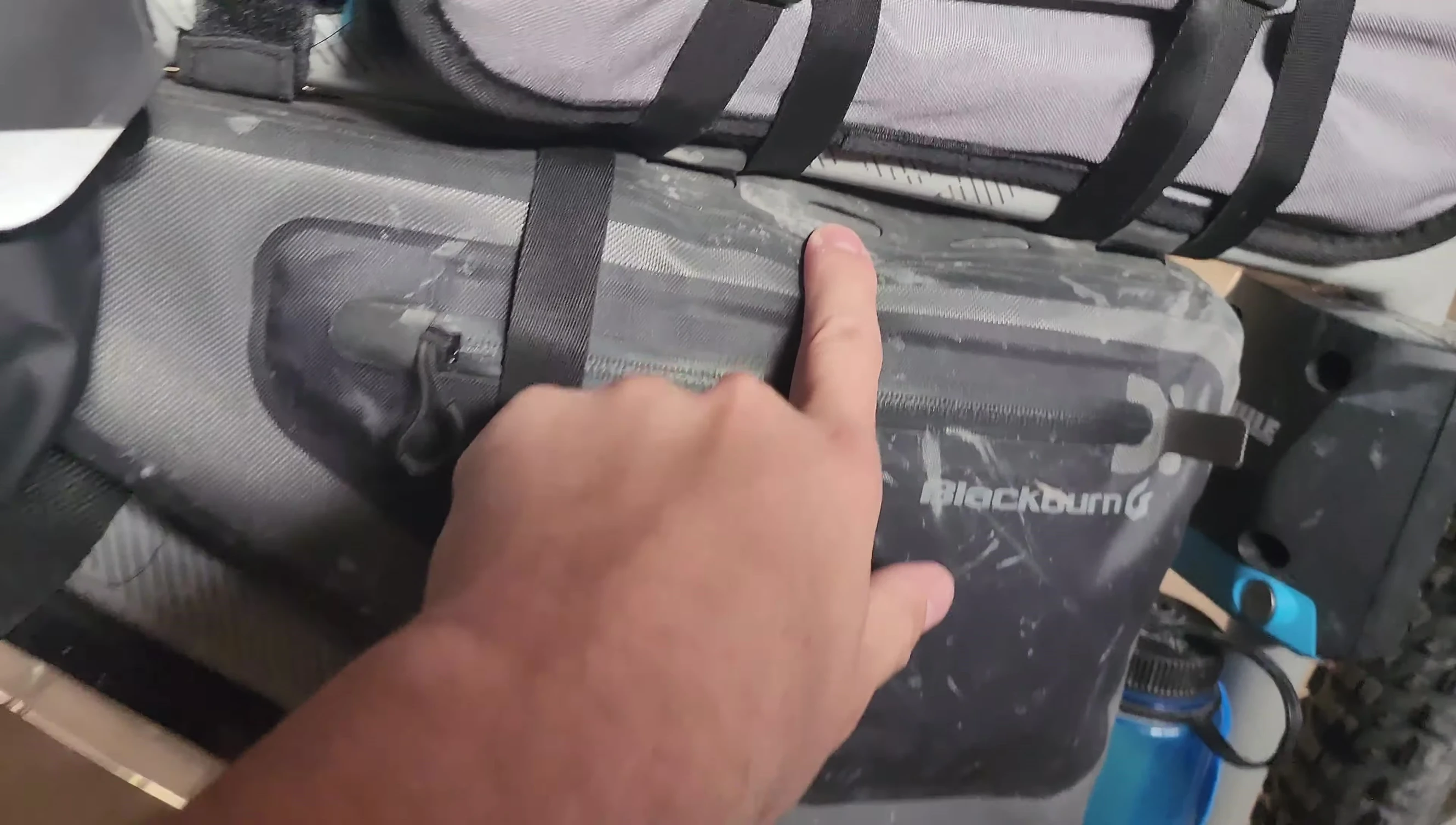 Close-up showing the holes on the frame bag for attaching straps
