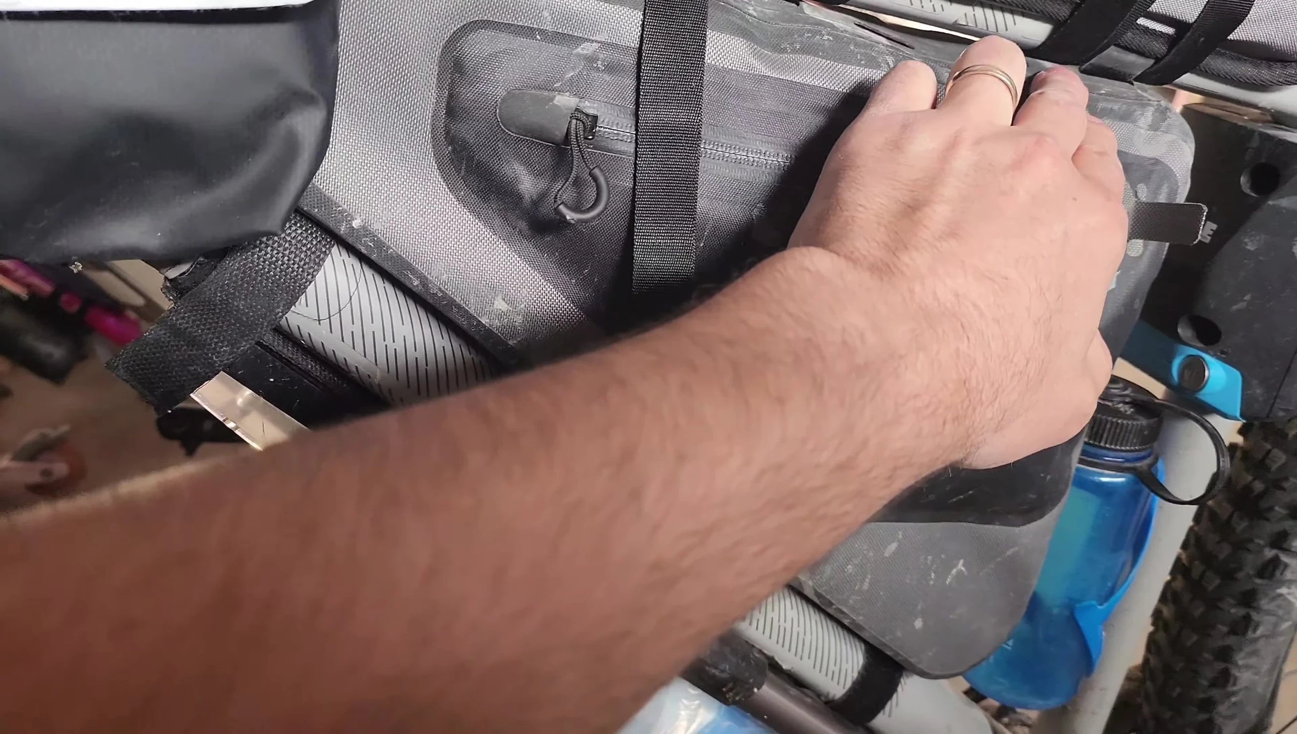 The frame bag with various straps attached