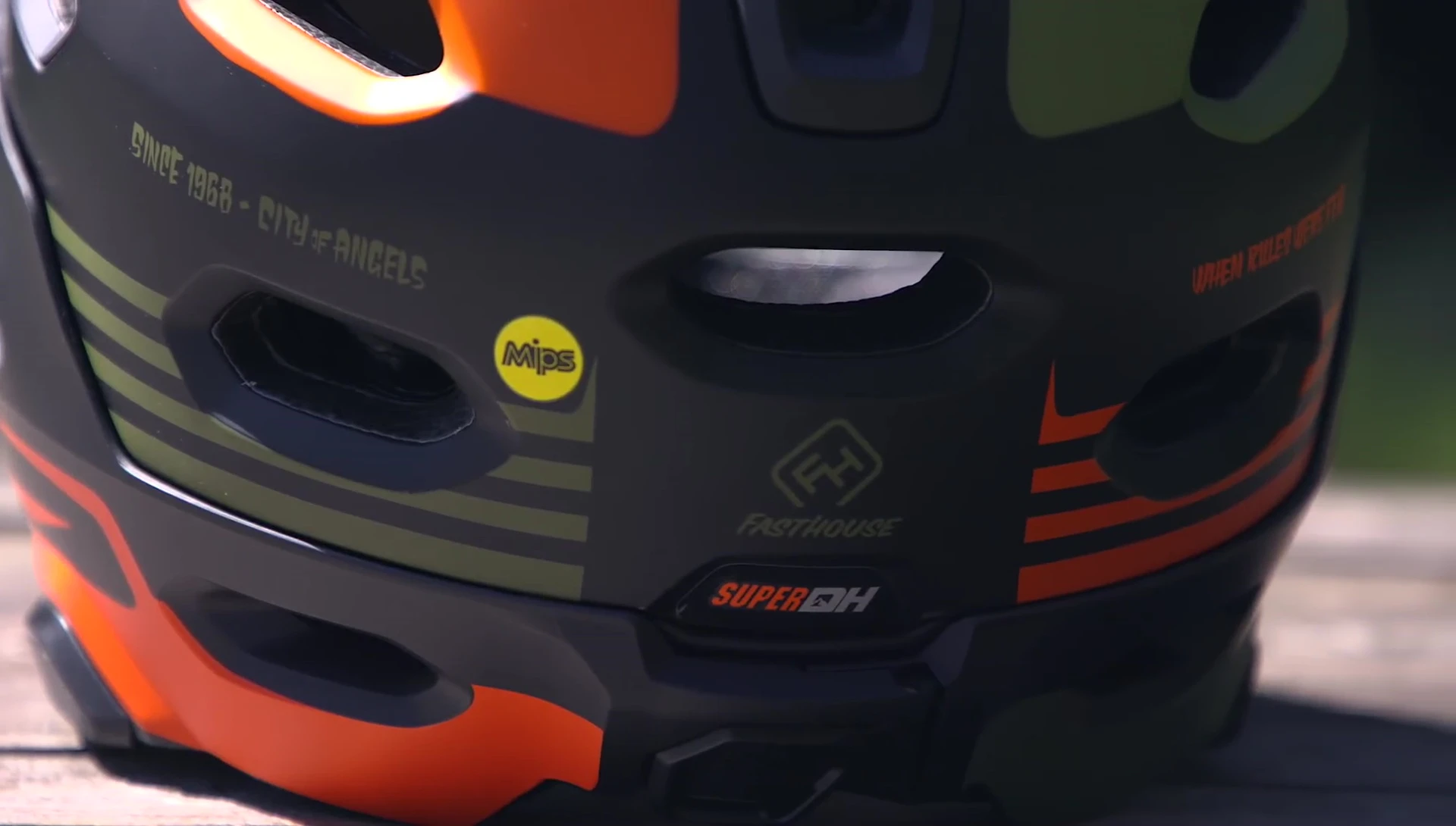 Rider showcasing the Super DH helmet with chin bar removed