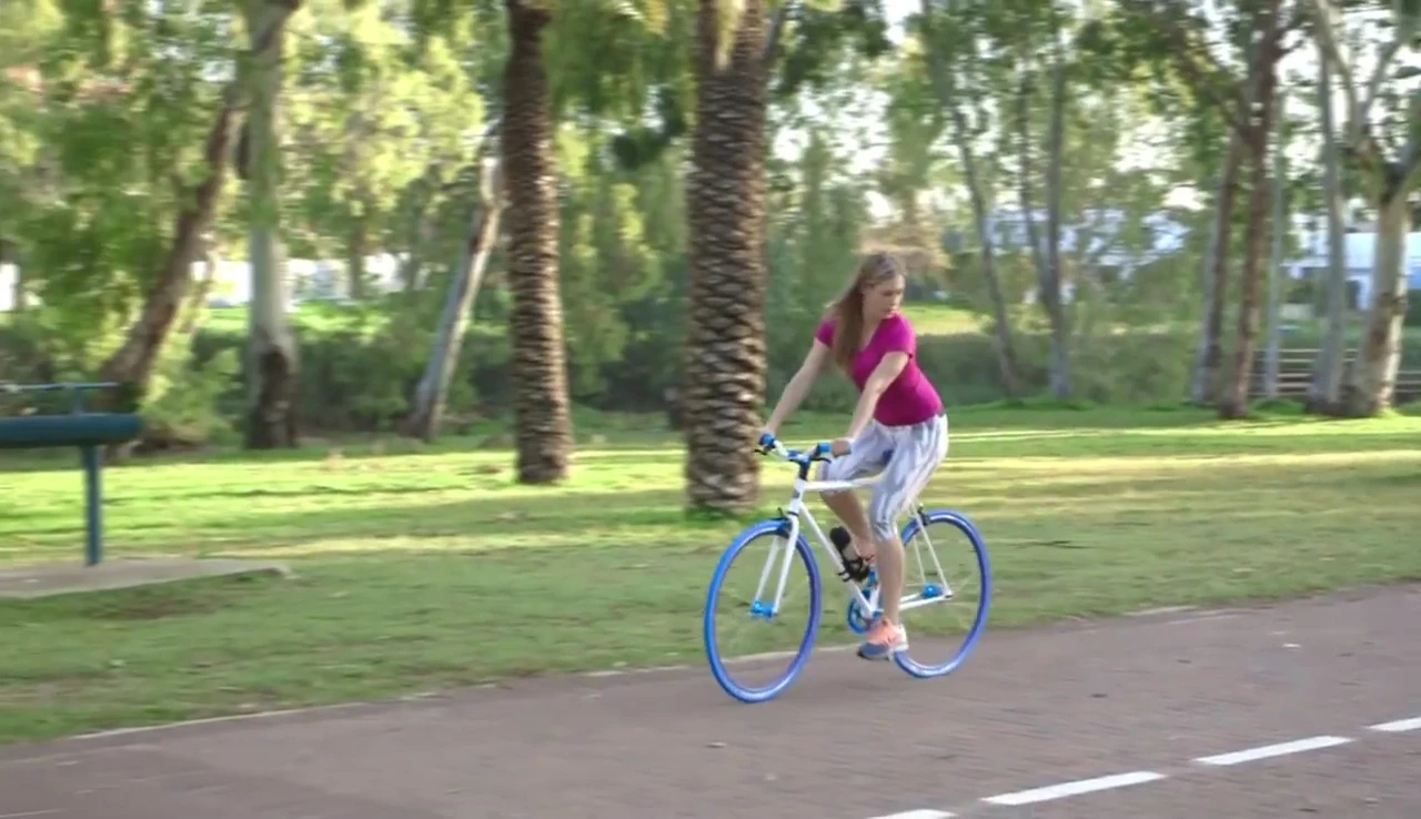 A cyclist dealing with a flat tire, highlighting the problem the product solves.