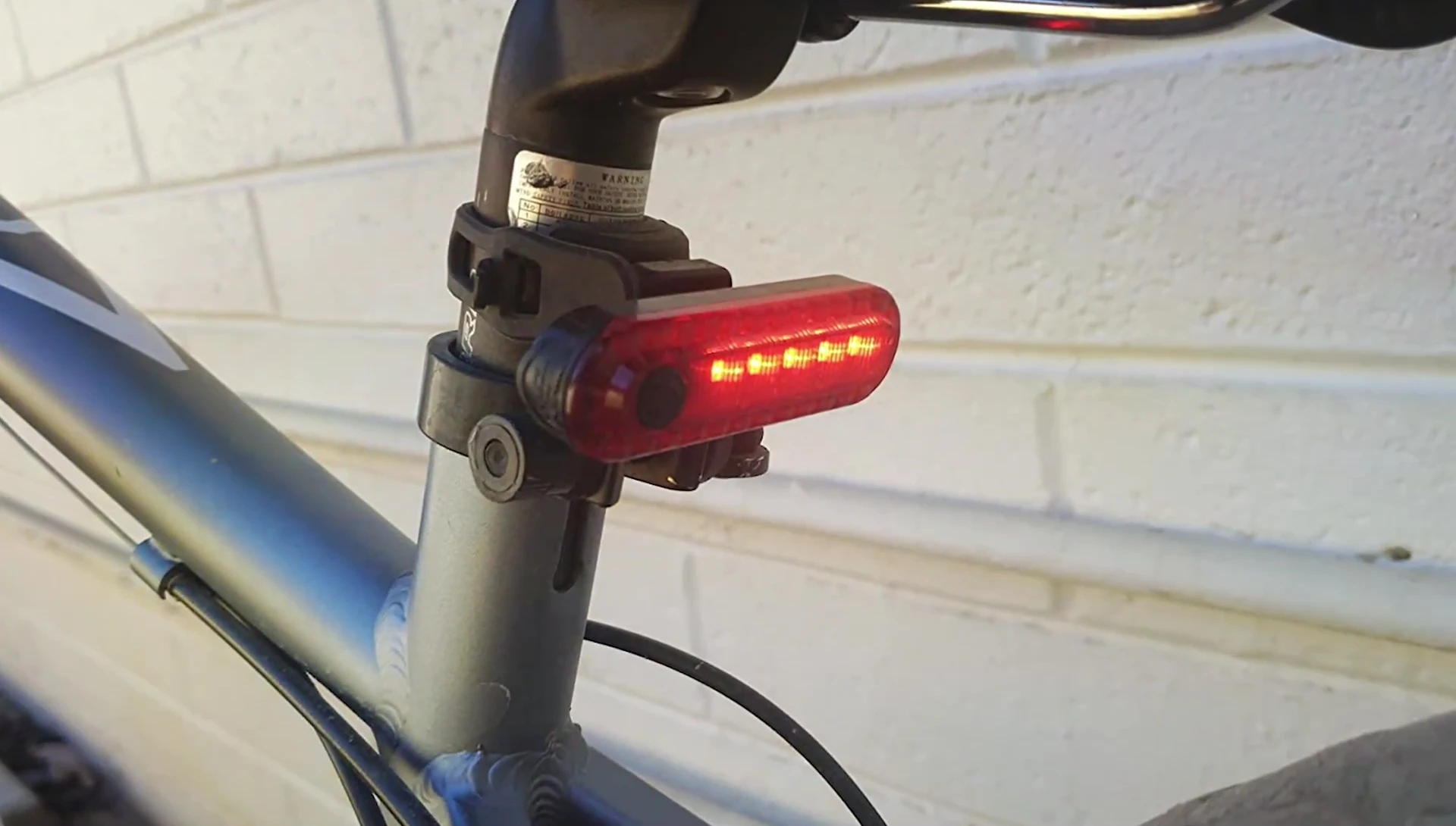 The e-By Fire lights mounted and in use on a bicycle.