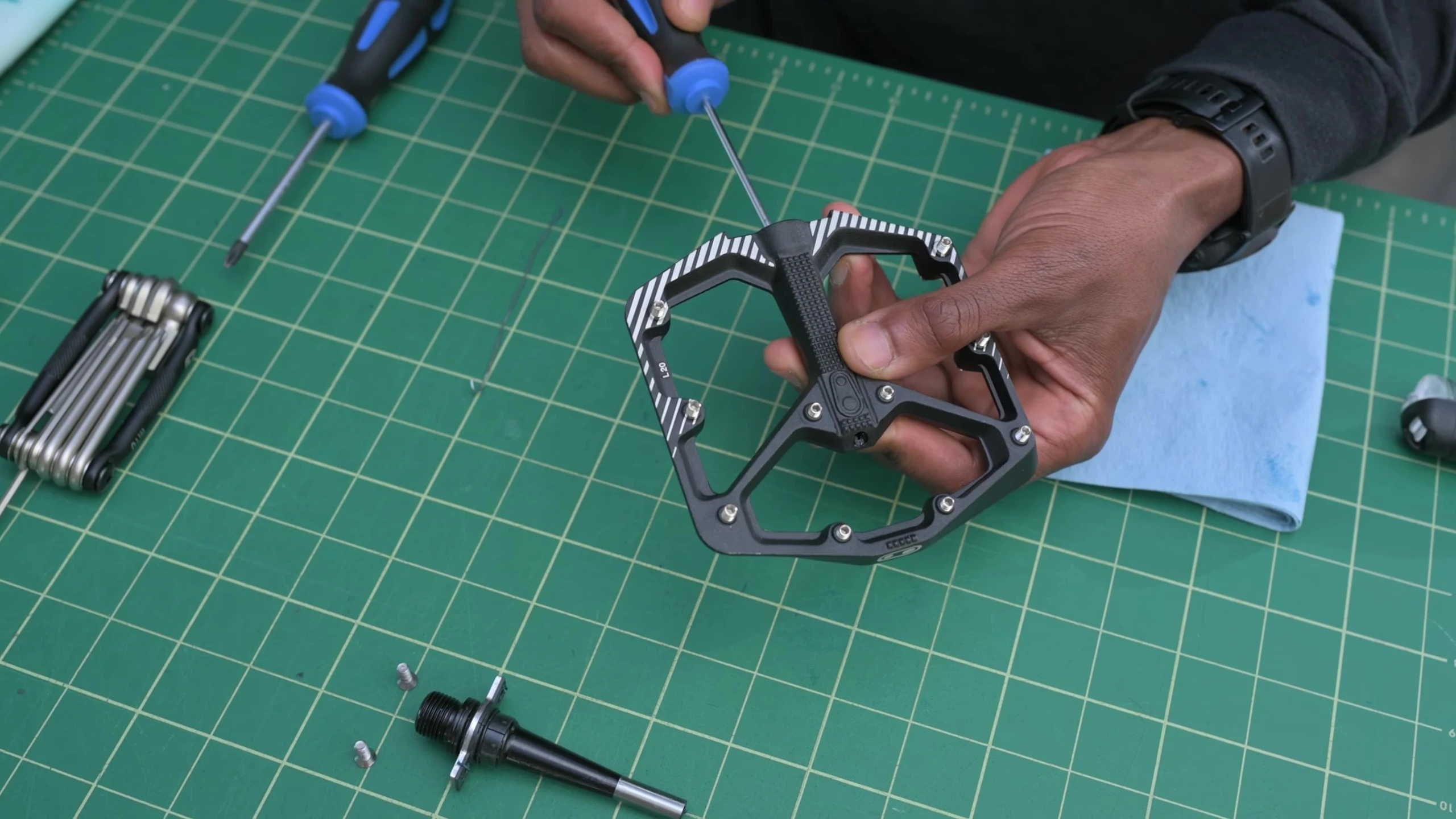 Using a paperclip to remove the outer bearing.