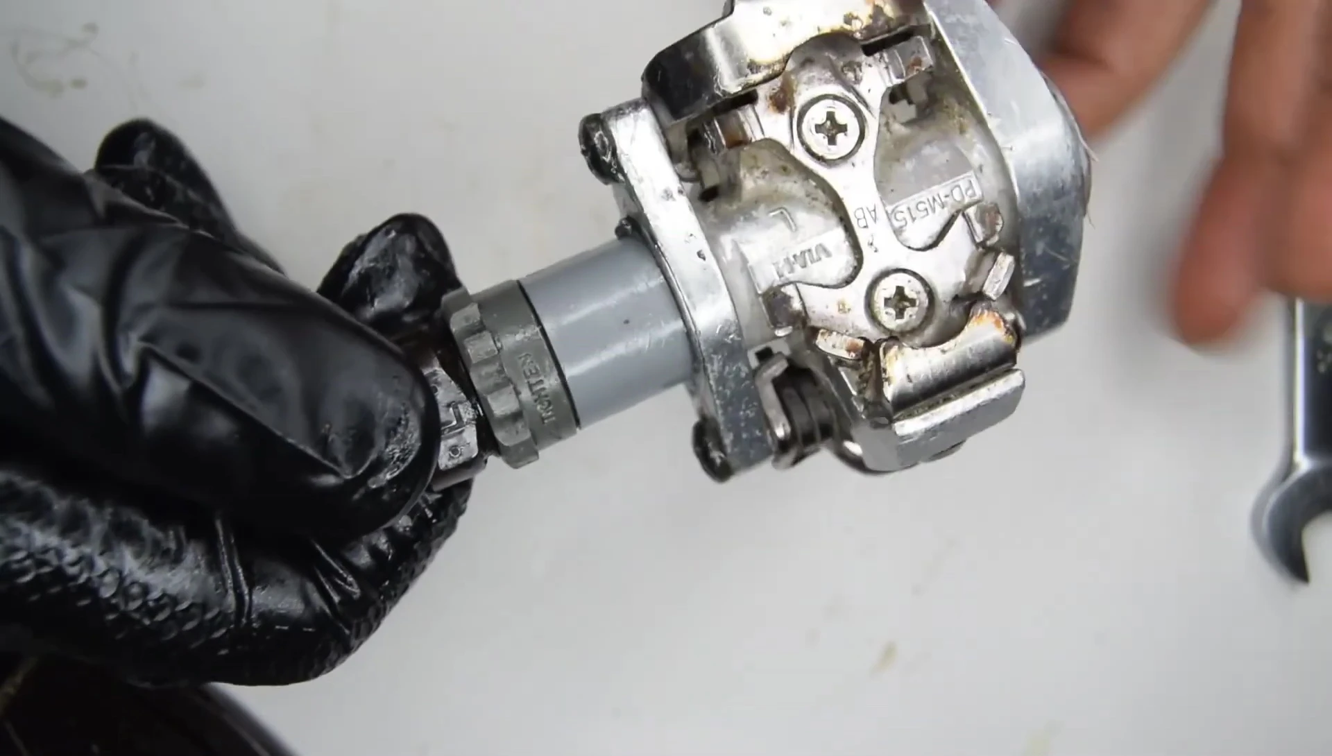 Checking for smooth pedal rotation and the absence of play.