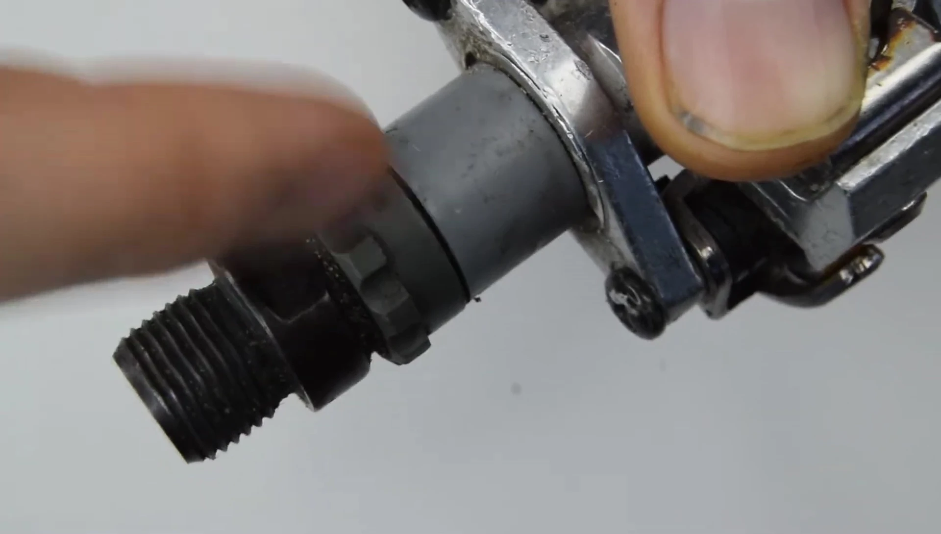 Removing the plastic lock ring using a Shimano TL-PD40 tool.