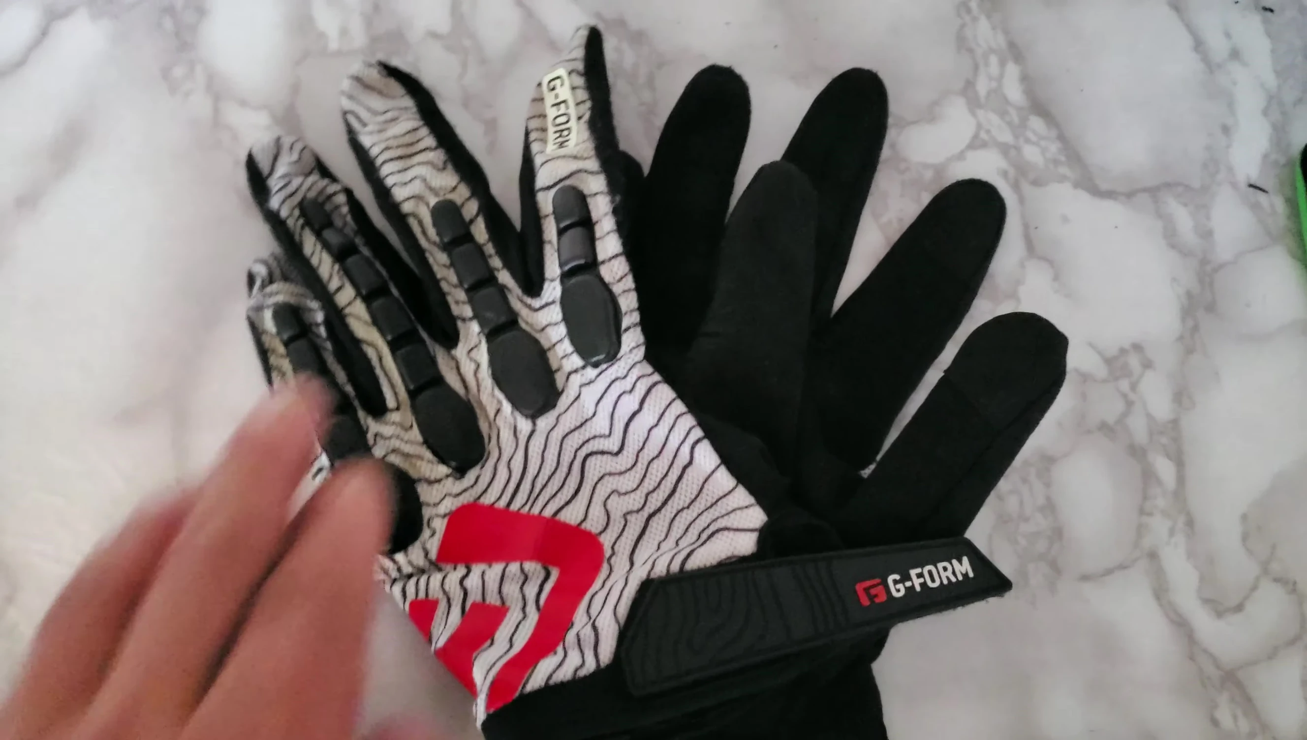 Showcasing the foam padding on the fingers of the G-Form gloves