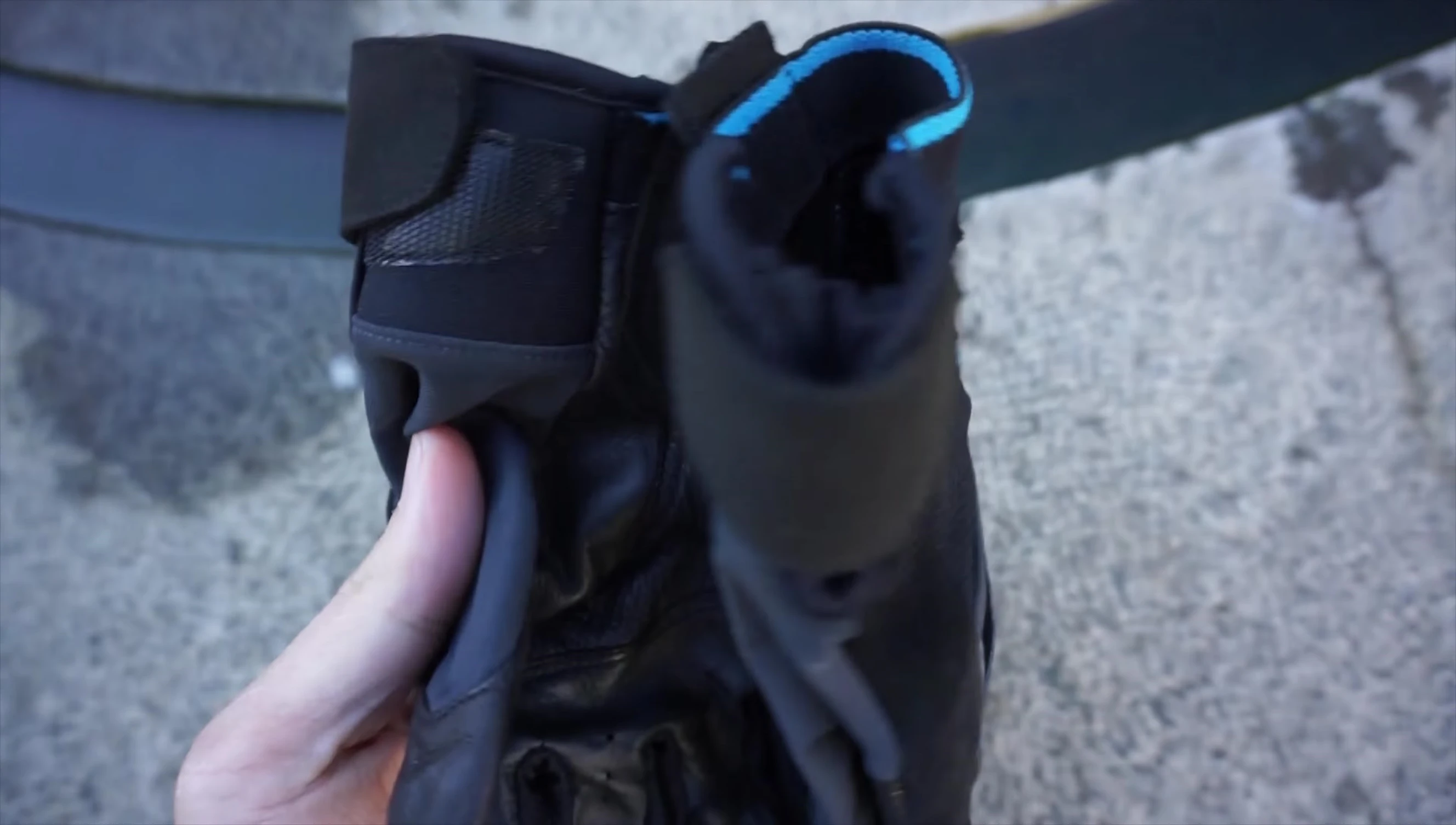 Demonstrating the magnetic closure between the gloves.