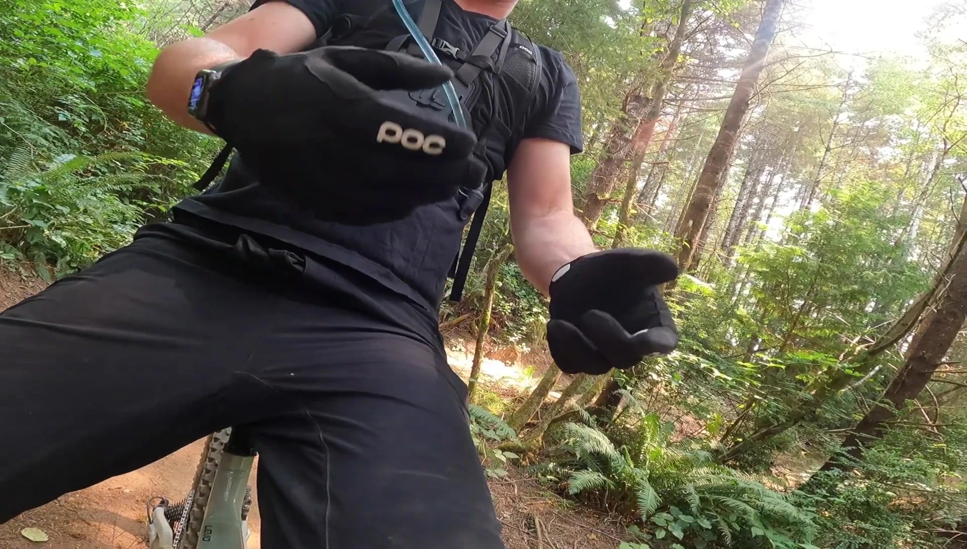 Rider taking off gloves
