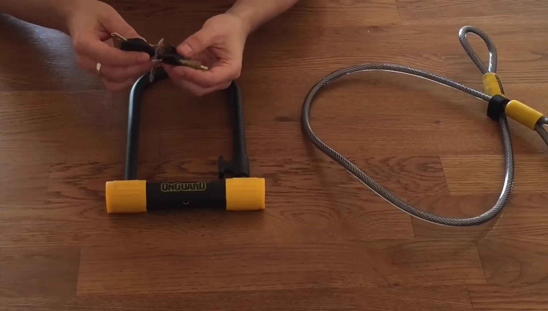 Showing the five keys included with the lock, highlighting the key with the built-in light.
