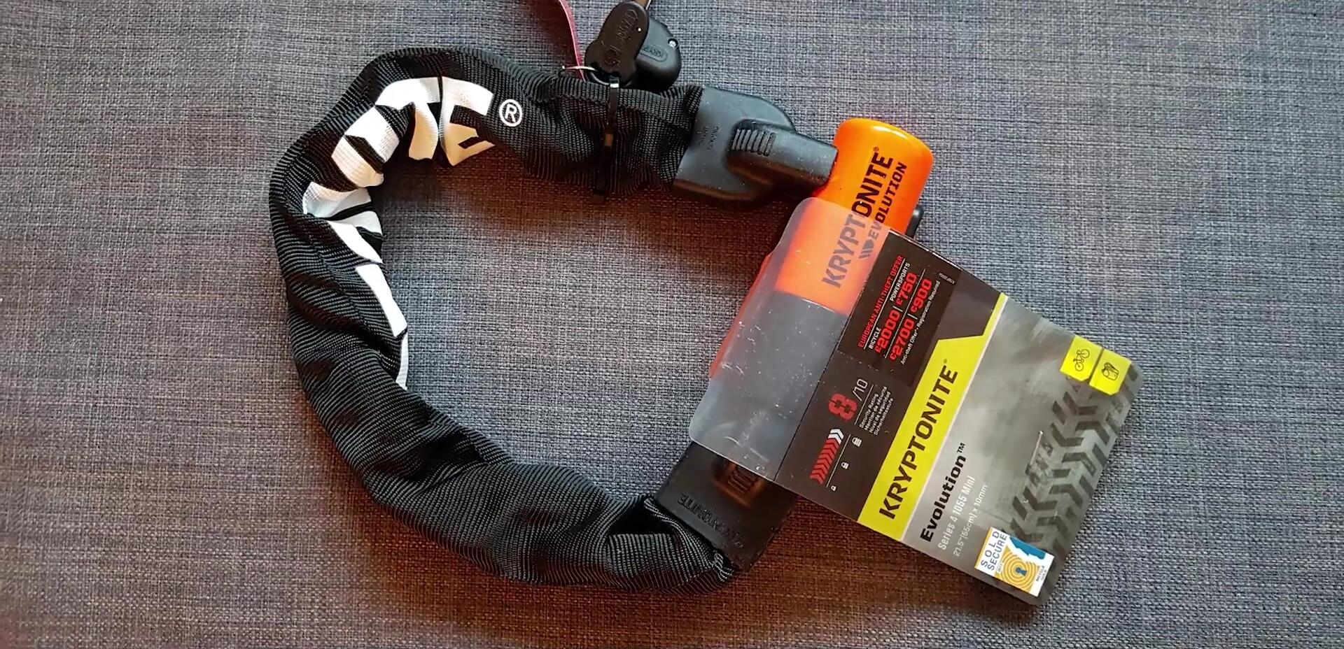 Kryptonite Kryptolok 955 Mini lock shown next to some cans of coke