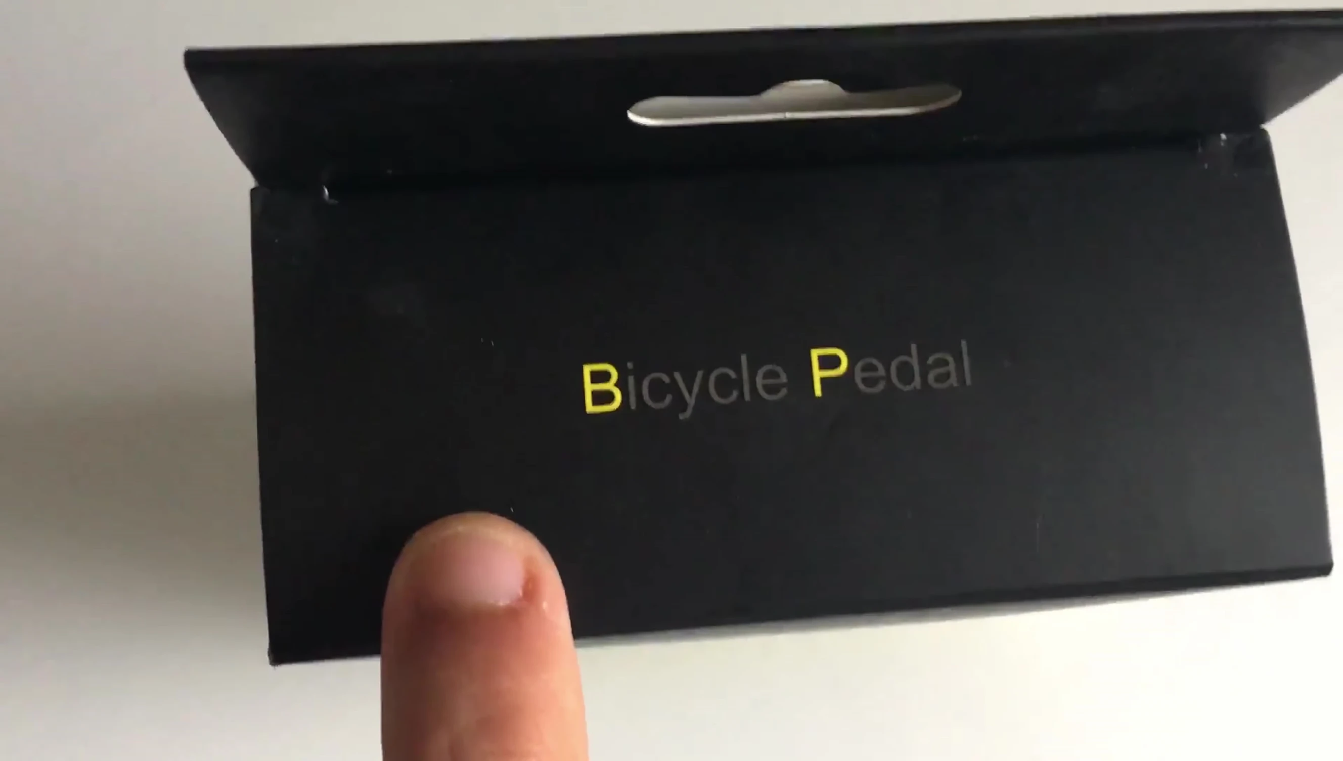 Close-up shot of the pedal packaging, showing the simple label.