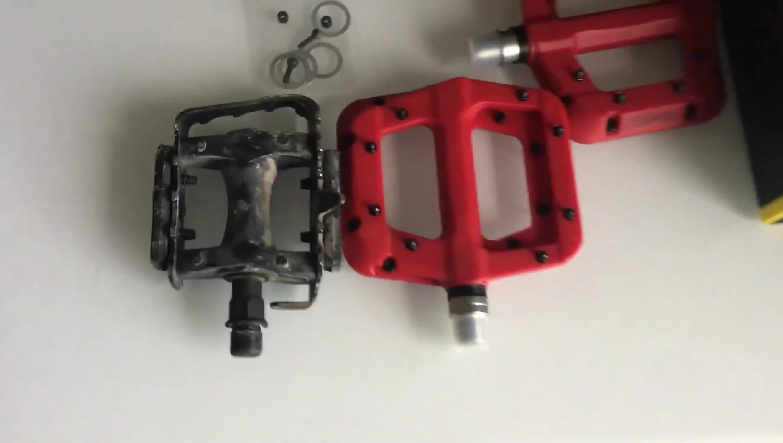 Comparison of the size difference between the Fooker pedals and the default pedals.